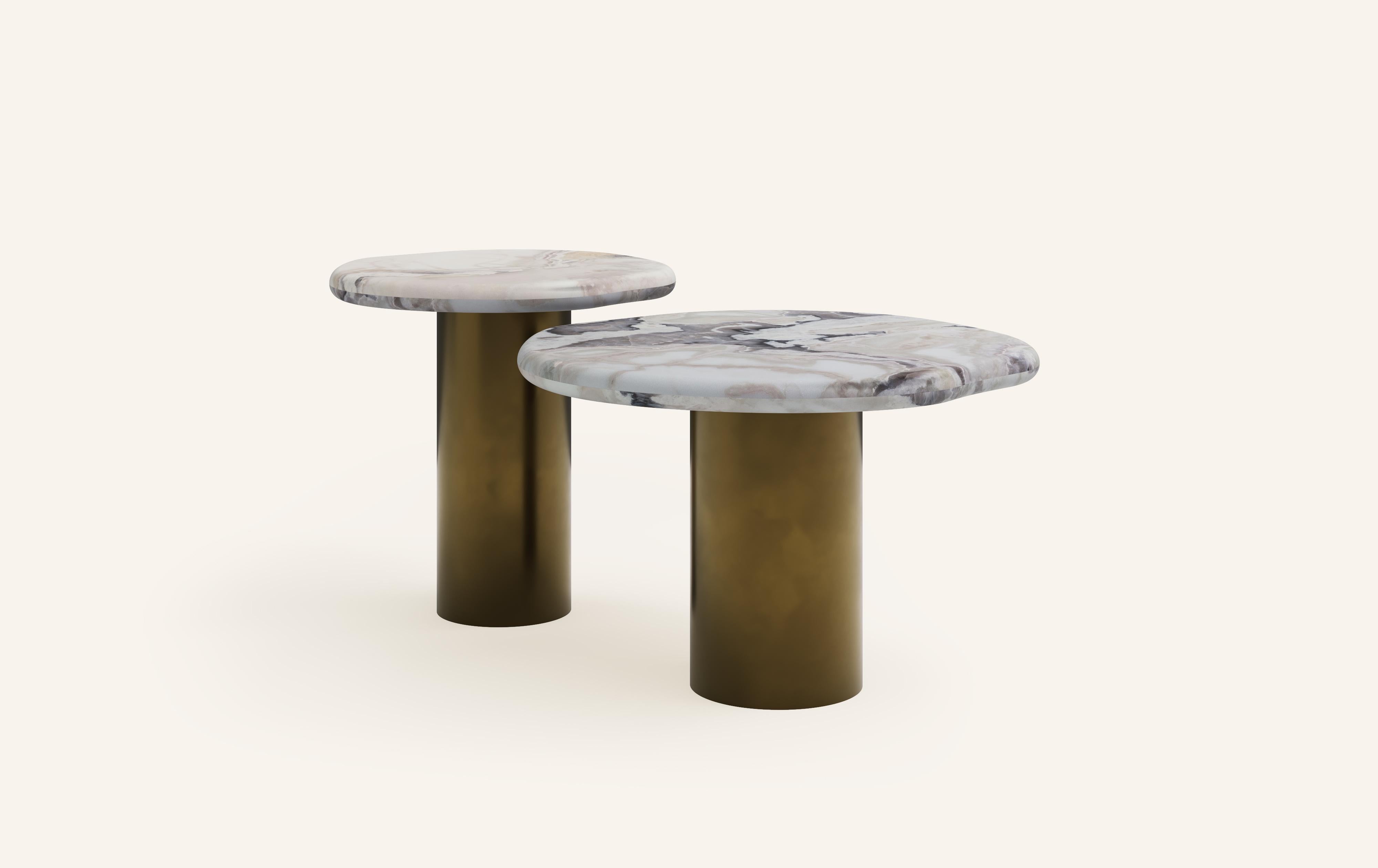 ‘LAGO’, ITALIAN FOR ‘LAKE’, HAS INSPIRED A FORM DERIVED FROM NATURE, TEXTURED WITH LUXURIOUS STONES AND METALS. THE COLLECTION ENCOURAGES NESTING AND LAYERING IN ITS AVAILABLE FORMS.

DIMENSIONS: (SIDE TABLES SOLD INDIVIDUALLY): 
18”L x 18”W x 18”H: