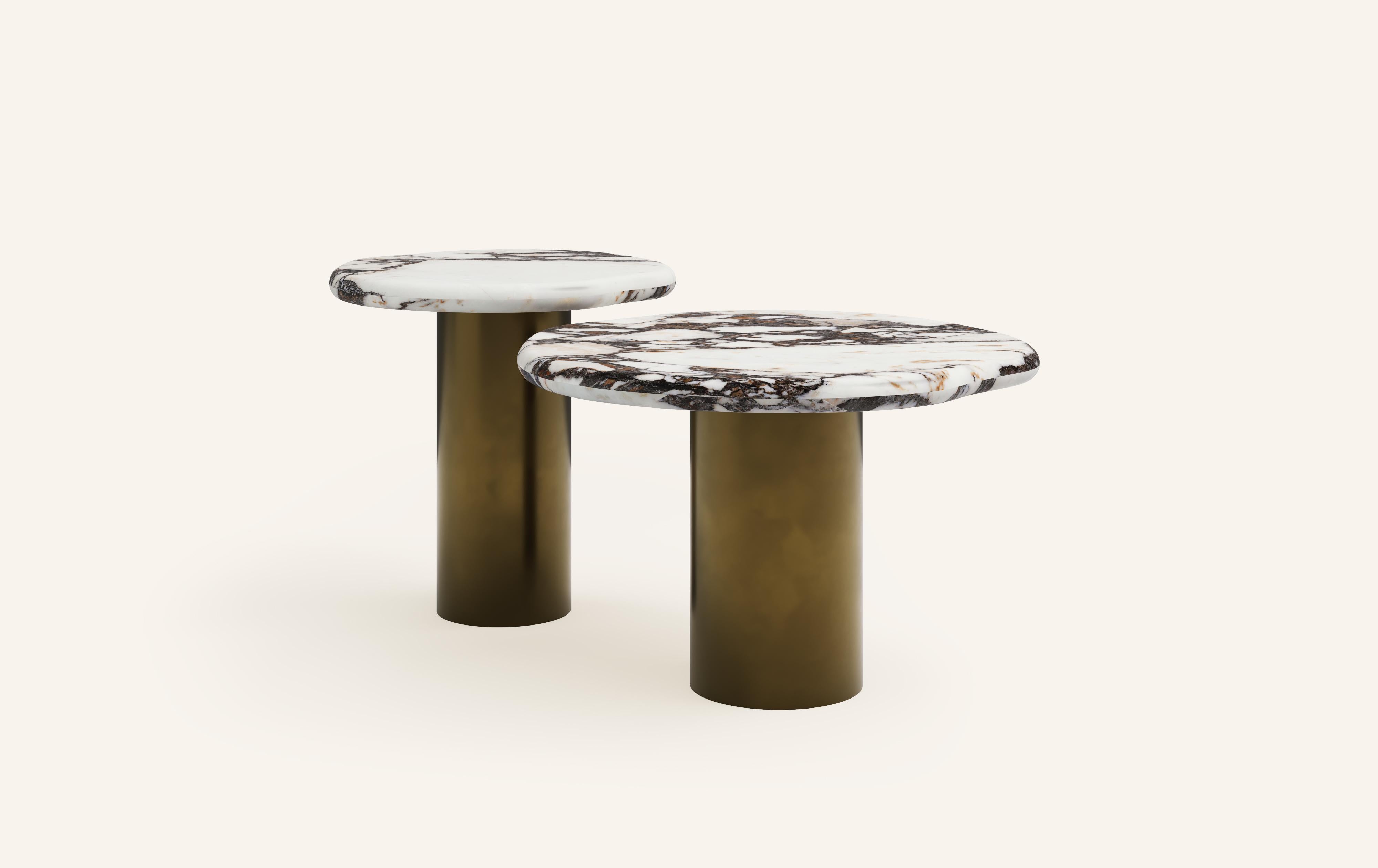 ‘LAGO’, ITALIAN FOR ‘LAKE’, HAS INSPIRED A FORM DERIVED FROM NATURE, TEXTURED WITH LUXURIOUS STONES AND METALS. THE COLLECTION ENCOURAGES NESTING AND LAYERING IN ITS AVAILABLE FORMS.

DIMENSIONS: (SIDE TABLES SOLD INDIVIDUALLY): 
18”L x 18”W x 18”H: