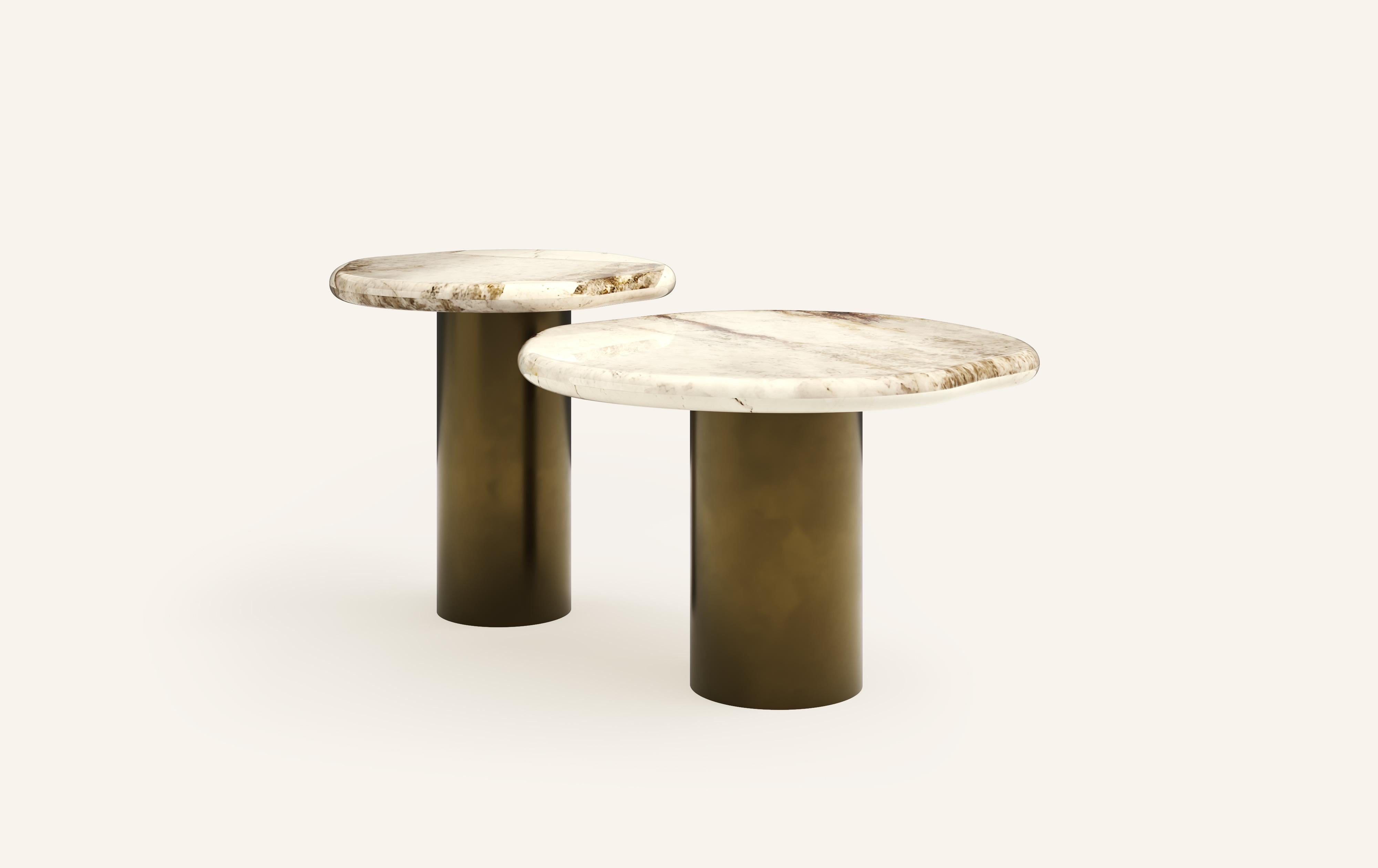 ‘LAGO’, ITALIAN FOR ‘LAKE’, HAS INSPIRED A FORM DERIVED FROM NATURE, TEXTURED WITH LUXURIOUS STONES AND METALS. THE COLLECTION ENCOURAGES NESTING AND LAYERING IN ITS AVAILABLE FORMS.

DIMENSIONS: (SIDE TABLES SOLD INDIVIDUALLY): 
24”L x 24”W x 16”H: