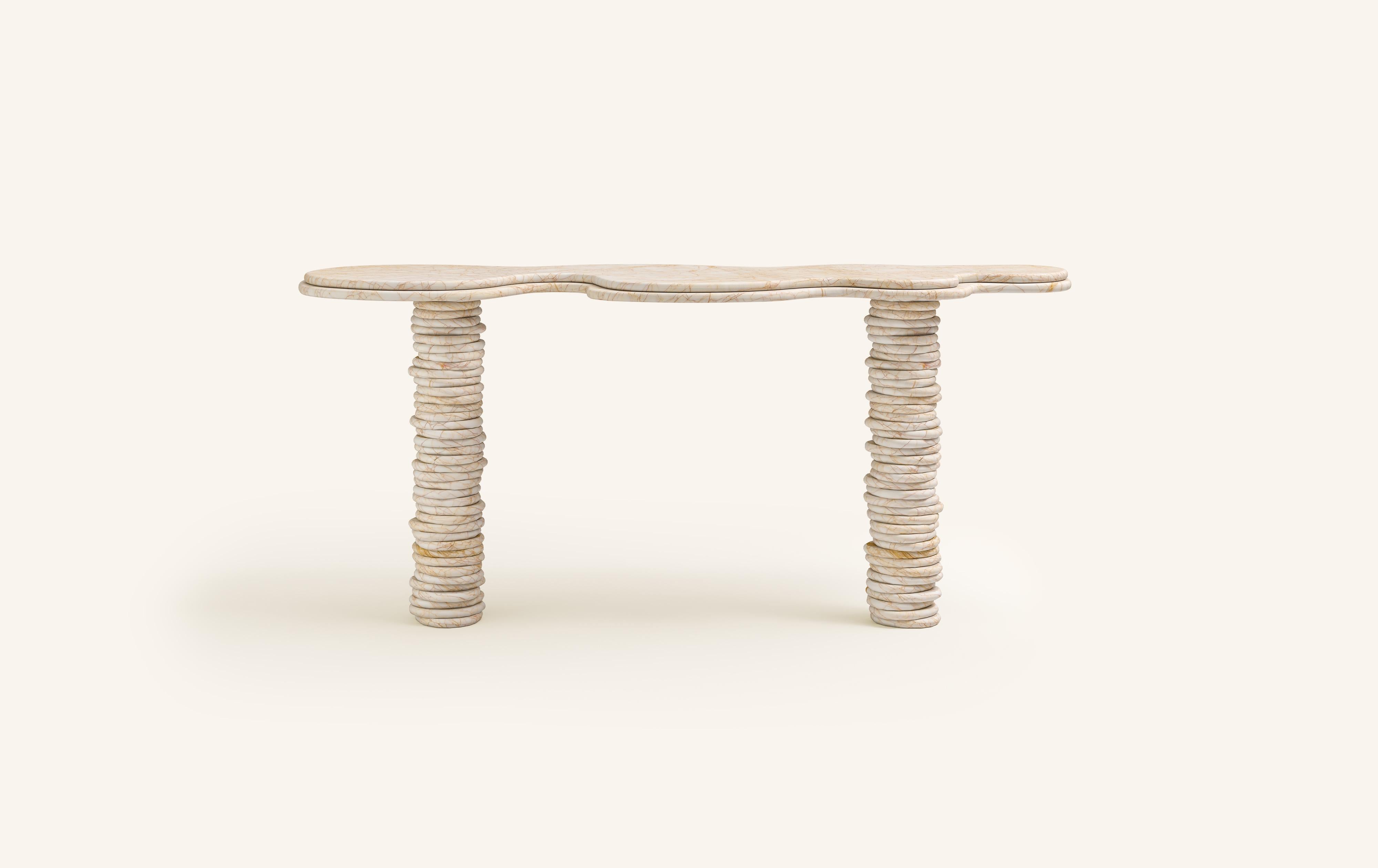 'ONDA', ITALIAN FOR 'WAVE', HAS INSPIRED A FREEFORM ORGANIC BODY, HEROING A COMPLEX AND TEXTURED COLLECTION. COMPRISING SIDE TABLES FOR LAYERING, COFFEE TABLES AND DINING TABLES.

DIMENSIONS:
60”L x 18”W x 29-3/4”H: 
- 1.5