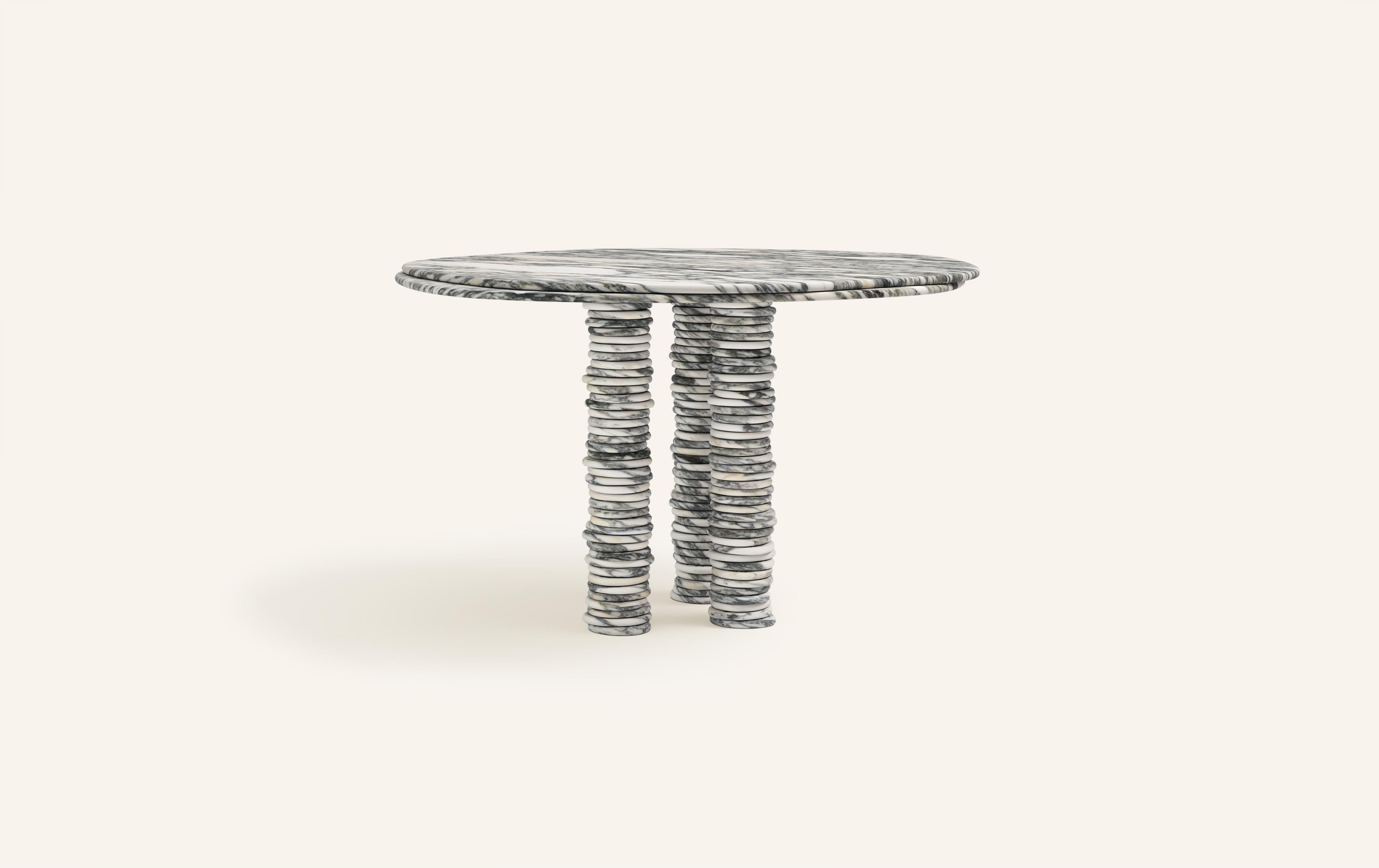 'ONDA', ITALIAN FOR 'WAVE', HAS INSPIRED A FREEFORM ORGANIC BODY, HEROING A COMPLEX AND TEXTURED COLLECTION. COMPRISING SIDE TABLES FOR LAYERING, COFFEE TABLES AND DINING TABLES.

DIMENSIONS:
54”L x 54”W x 29-3/4”H: 
- 1.5