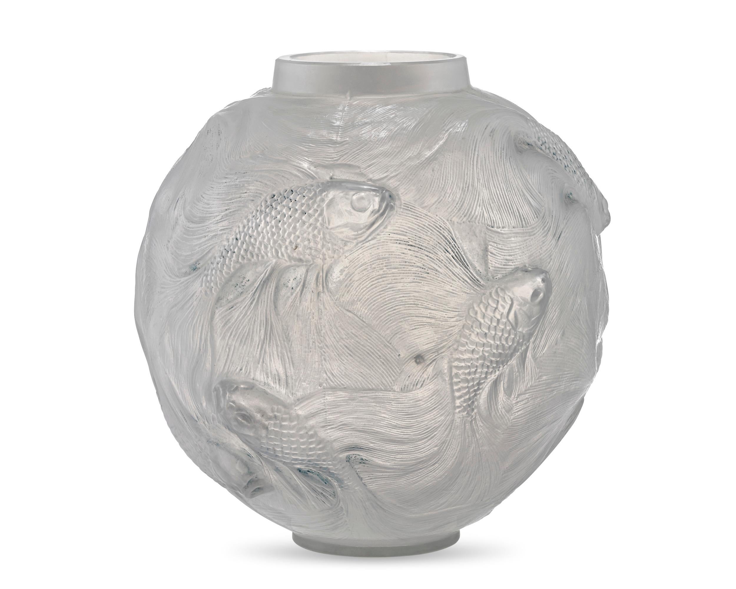 The work of famed French glass master René Lalique, this dynamic vase is crafted in the rare and intricate Formose pattern. Conceived in 1924 during the height of Art Deco, its spherical design is formed from both clear and frosted glass that