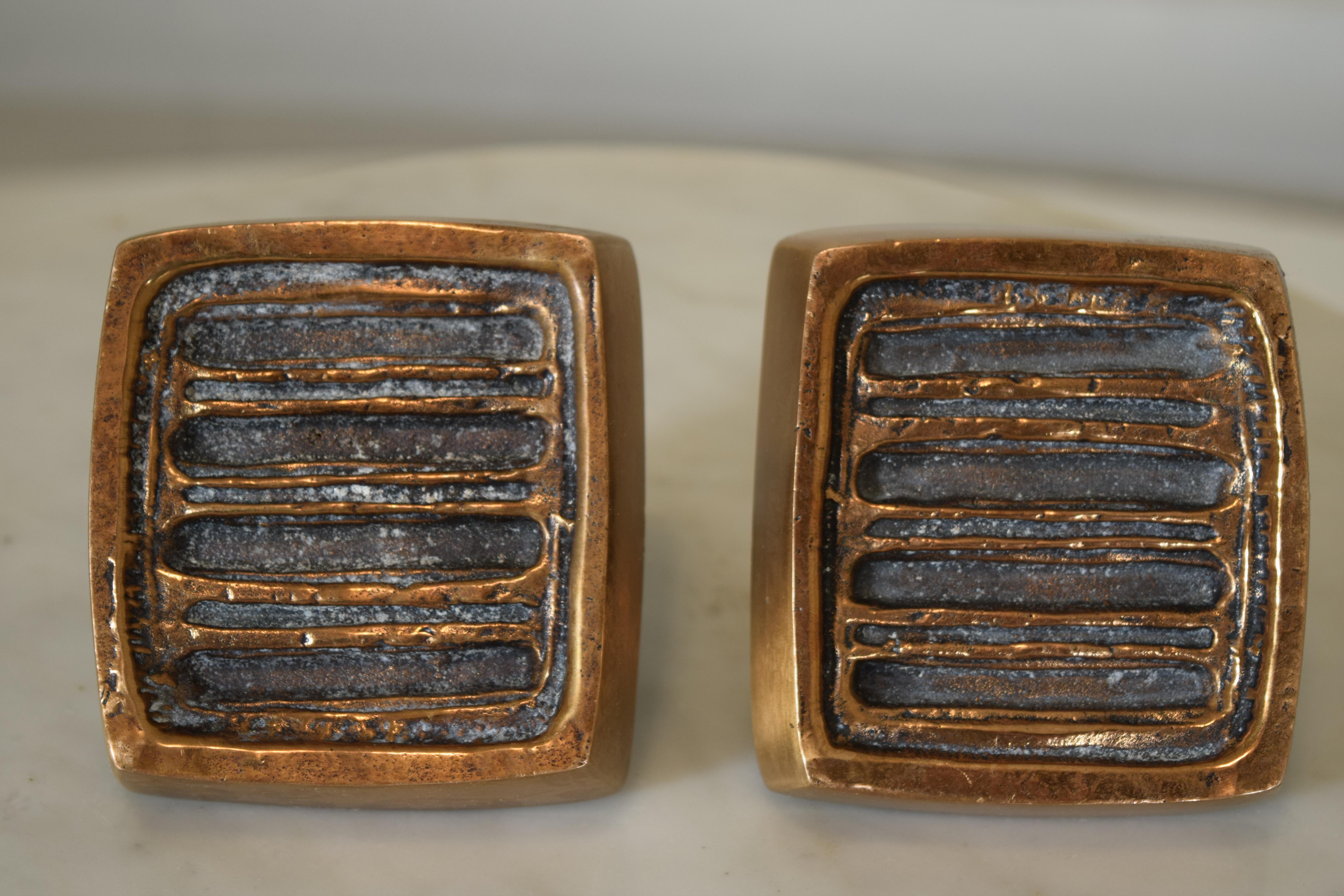 A pair of abstract bronze pulls for use in modernist residential or commercial entry door applications, circa 1960 by Forms and Surfaces. This set is likely designed by Sherrill Broudy or David Gillespie. Measures 3.75