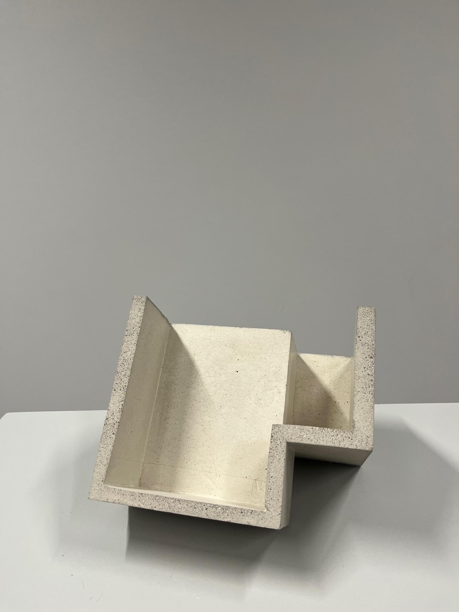 Handcrafted geometric concrete sculpture Formworks 3 by Spanish designer Manolo Menéndez. It can serve as a centerpiece, a fruit bowl, or simply as a striking minimalist artwork.
It is part of a collection of ten sculptural pieces conceived in a