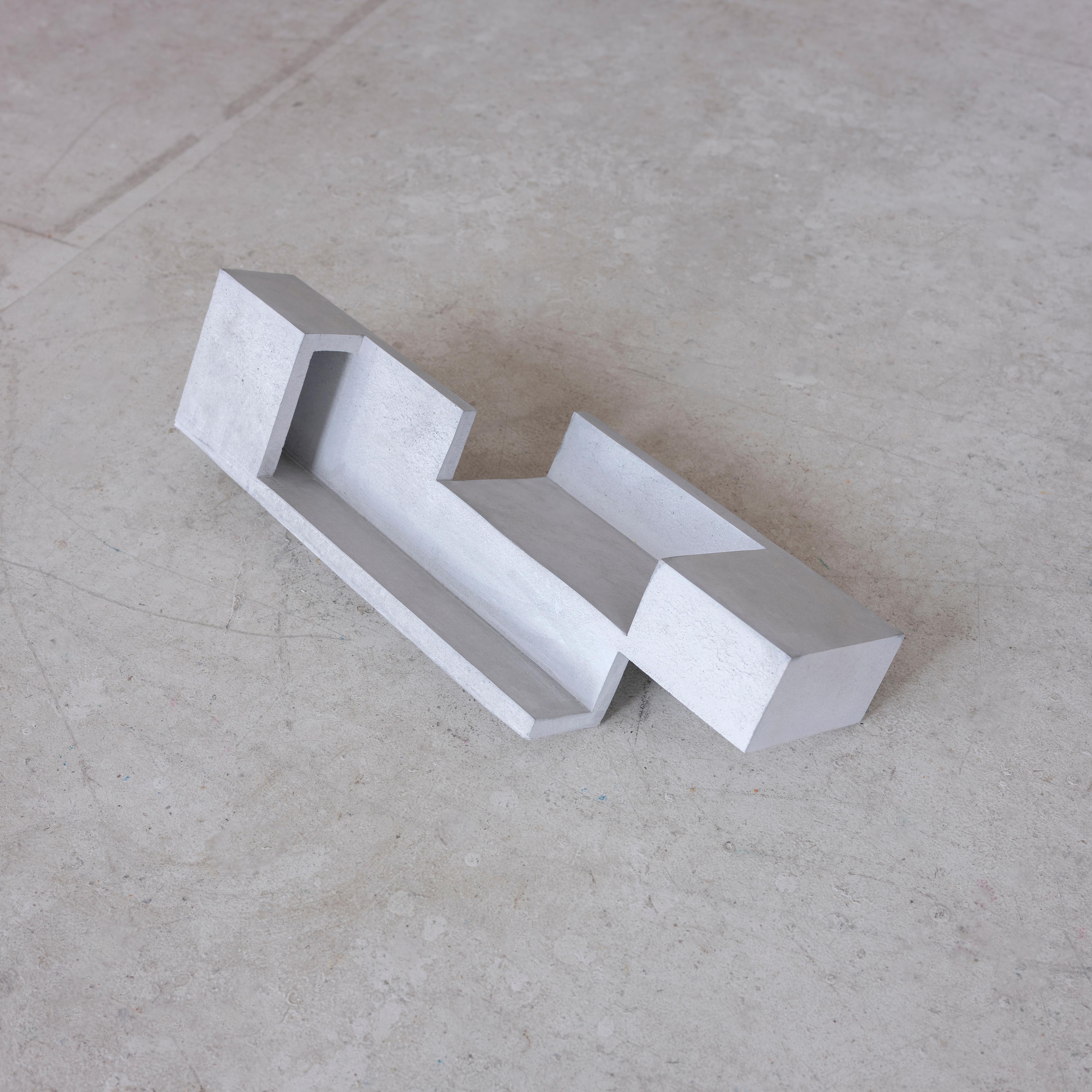 Handcrafted geometric concrete sculpture Formworks 7 by Spanish designer Manolo Menéndez. It can serve as a centerpiece, a fruit bowl, or simply as a striking minimalist artwork.
It is part of a collection of ten sculptural pieces conceived in a