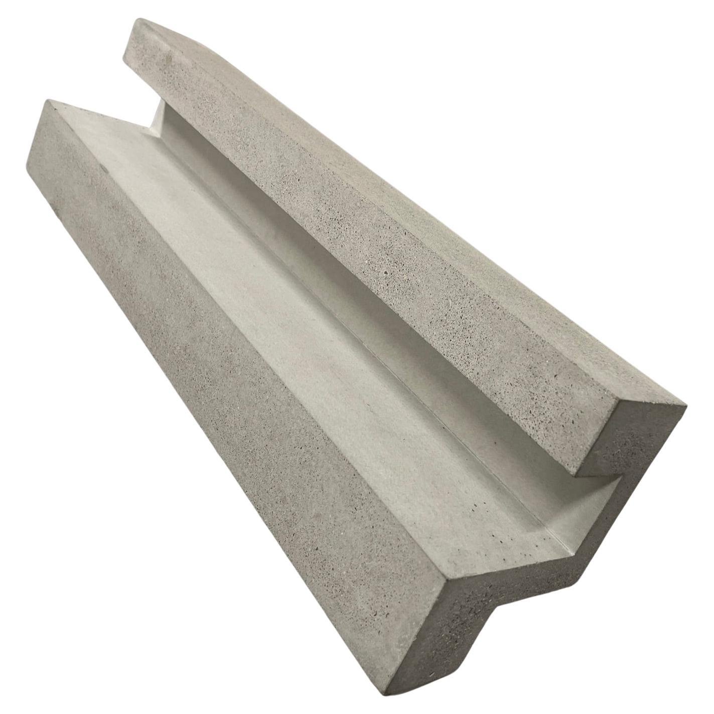 Handcrafted geometric concrete sculpture Formworks 9 by Spanish designer Manolo Menéndez. It can serve as a centerpiece, a fruit bowl, or simply as a striking minimalist artwork.
It is part of a collection of ten sculptural pieces conceived in a