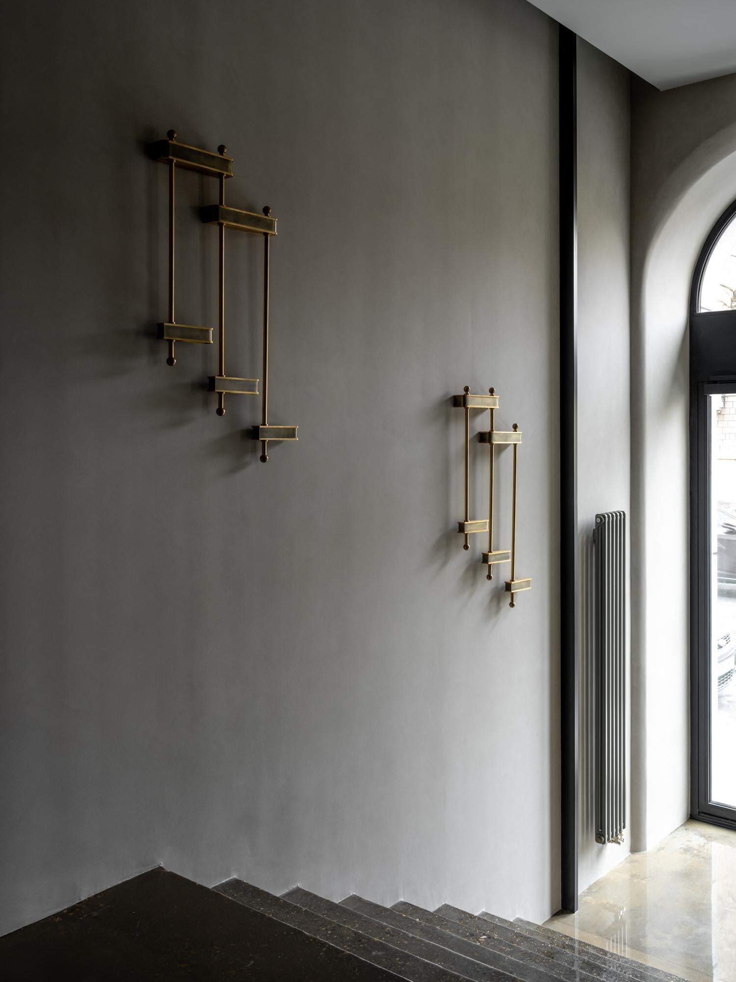 Introducing O&A London's Fornacis Wall Light – the perfect addition to any stairway! This contemporary metal fixture has a unique stepped form that makes it an ideal choice for illuminating staircases, creating stylish yet functional lighting.