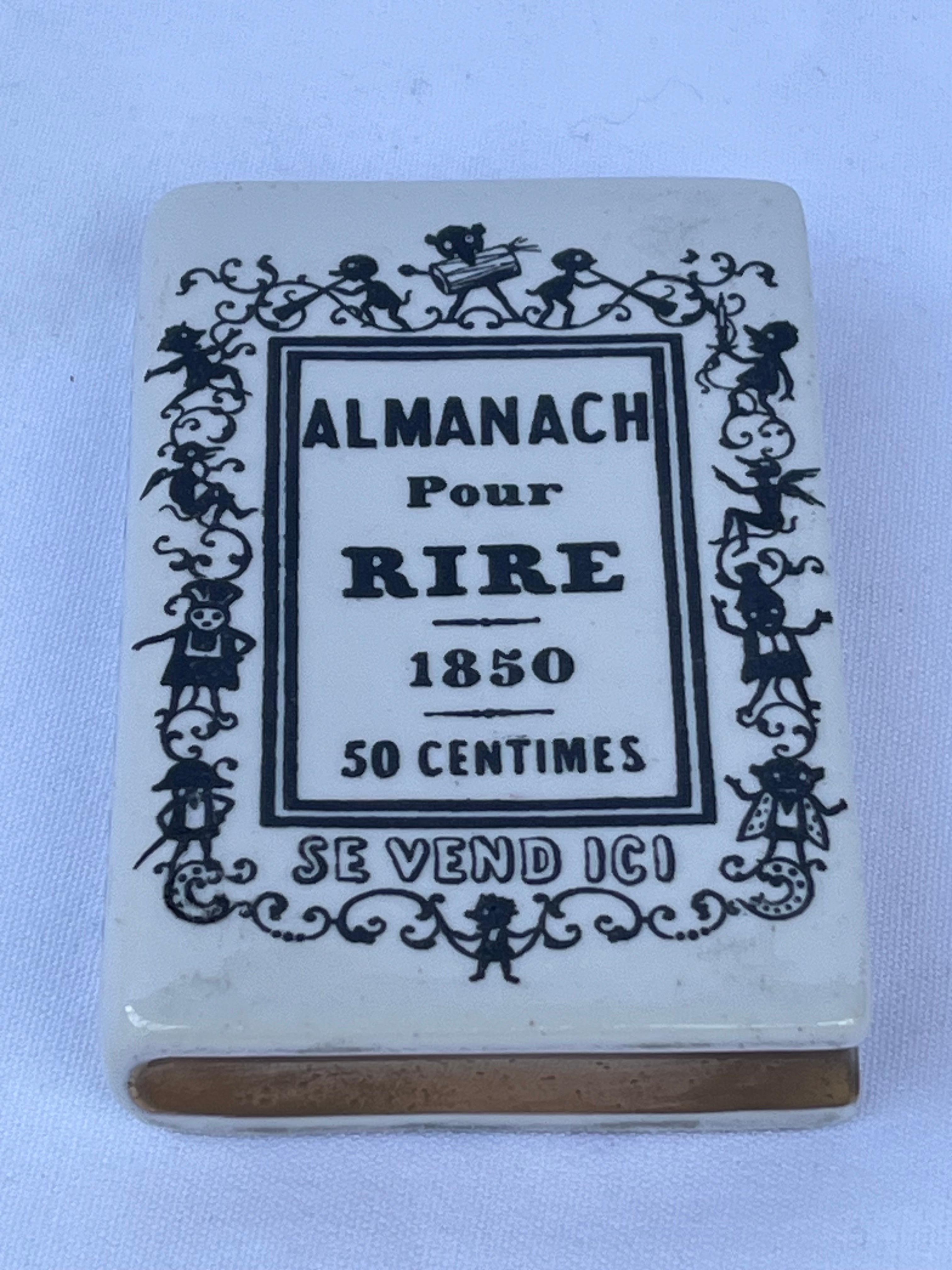 A perfect little faux book. The Almanach Pour Rire. By none other than Piero Fornasetti. This vintage desk accessory or paperweight is the ultimate addition to your interior. And hey, it's just for laughs. I really needn't say much more about this
