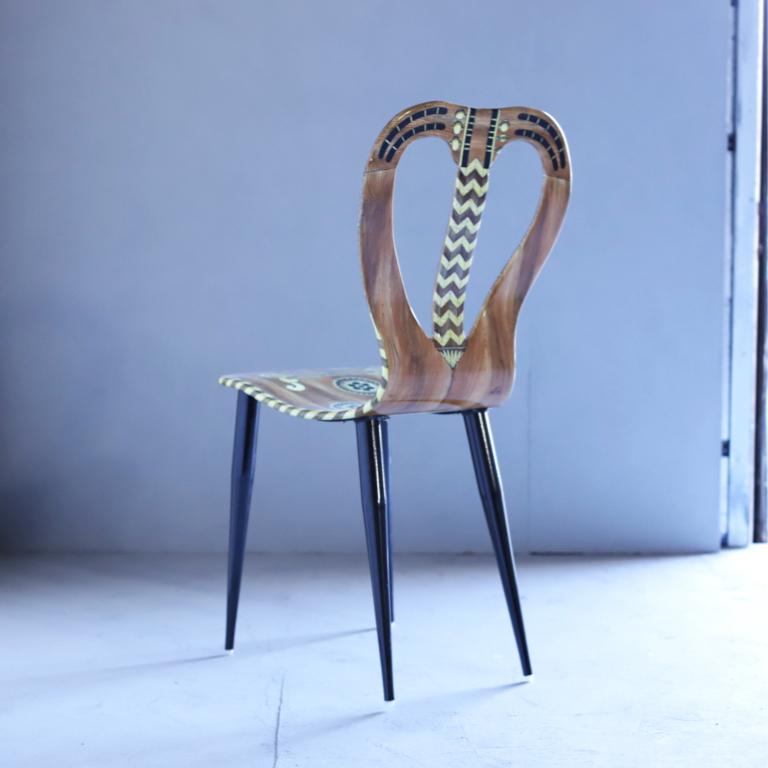 A “Musicale” chair by Atelier Fornasetti. Lithographically printed. Hand colored wood, lacquer, metal tubular legs.
 