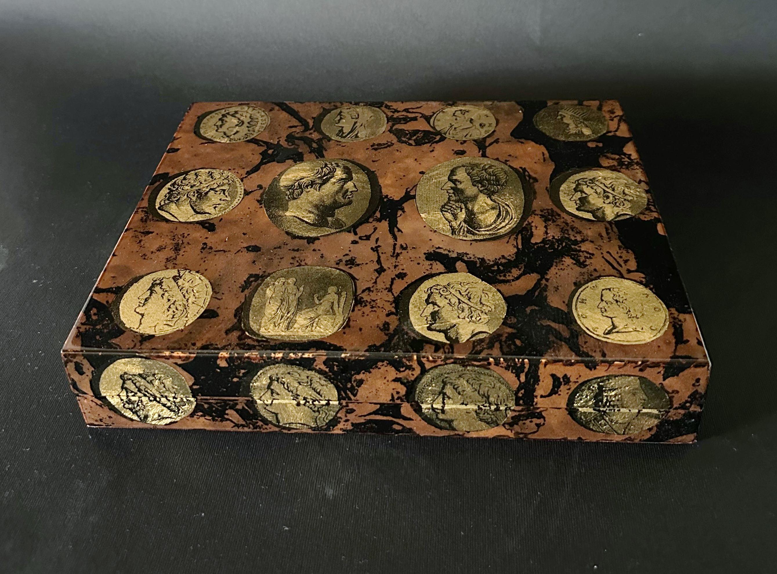 Vintage Italian wooden cigar humidor box with cammei design on faux marble / made in Milan Italy by Fornasetti, in the 1980s
Original metal label inside
Measures: width 10 inches, depth 7.5 inches, height 2 inches
1 available in stock in Italy
Order