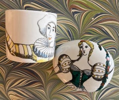 Fornasetti “Commedia” Ceramic Paperweight and Cup Pair