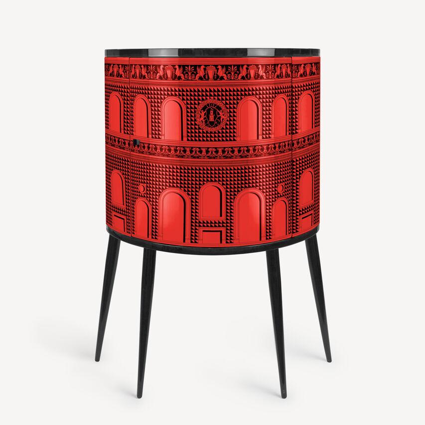 The Fornasetti console is a wooden storage piece of furniture silkscreened and laquered by hand following the Atelier's traditional method.

The motif evokes the Italian Renaissance, according to that metaphorical journey through time undertaken