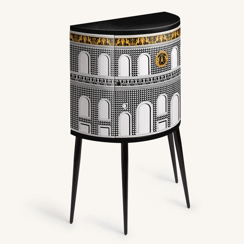 The Fornasetti console is a wooden storage piece of furniture silkscreened and laquered by hand following the Atelier's traditional method.

The motif evokes the Italian Renaissance, according to that metaphorical journey through time undertaken