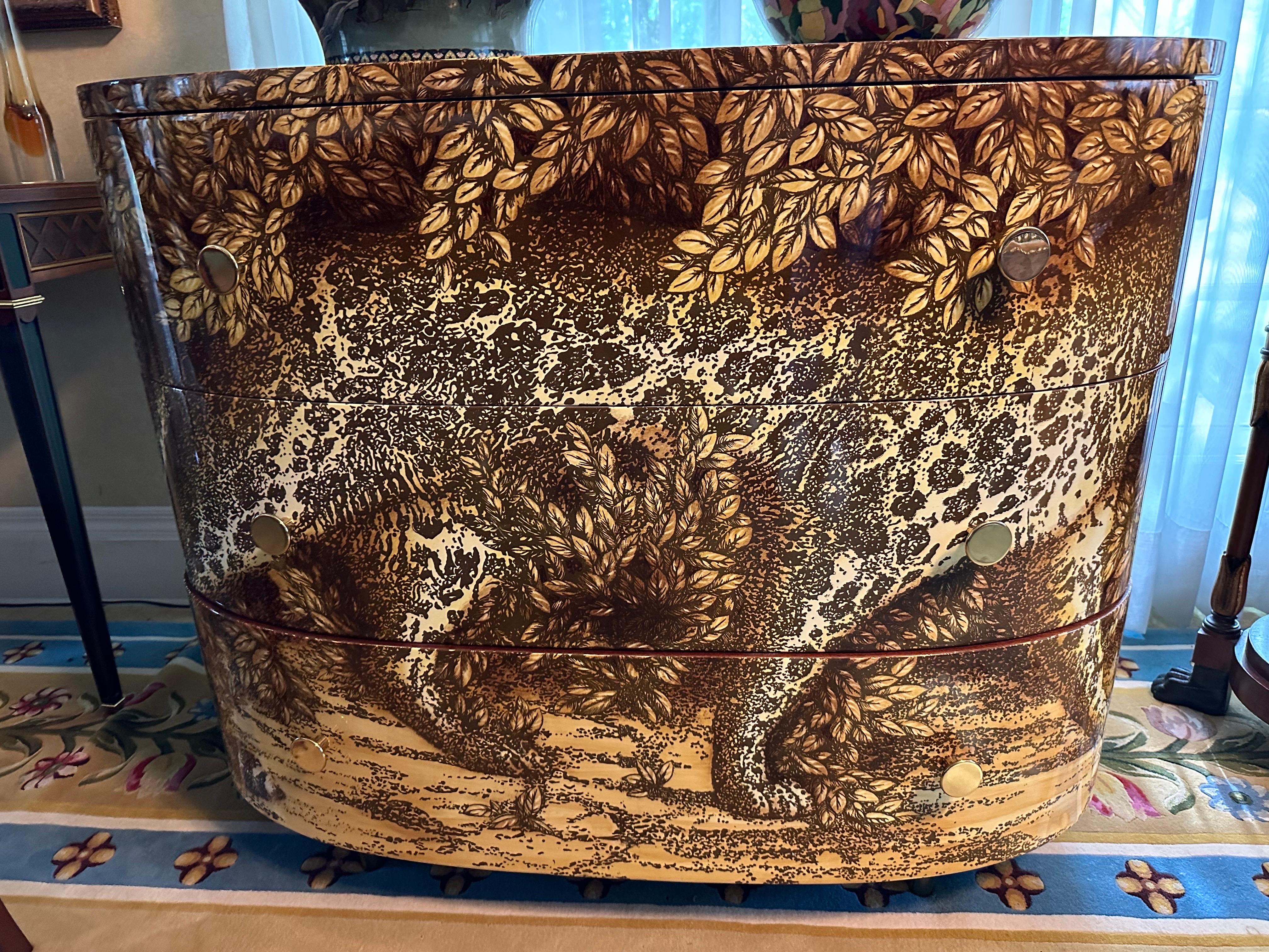 The elegant gait of the leopard inspired the artist's imagination. Designed in the 1950s for the living room of the family villa, this exotically decorated, hand-silkscreened, painted, and lacquered wooden dresser was one of Piero Fornasetti's