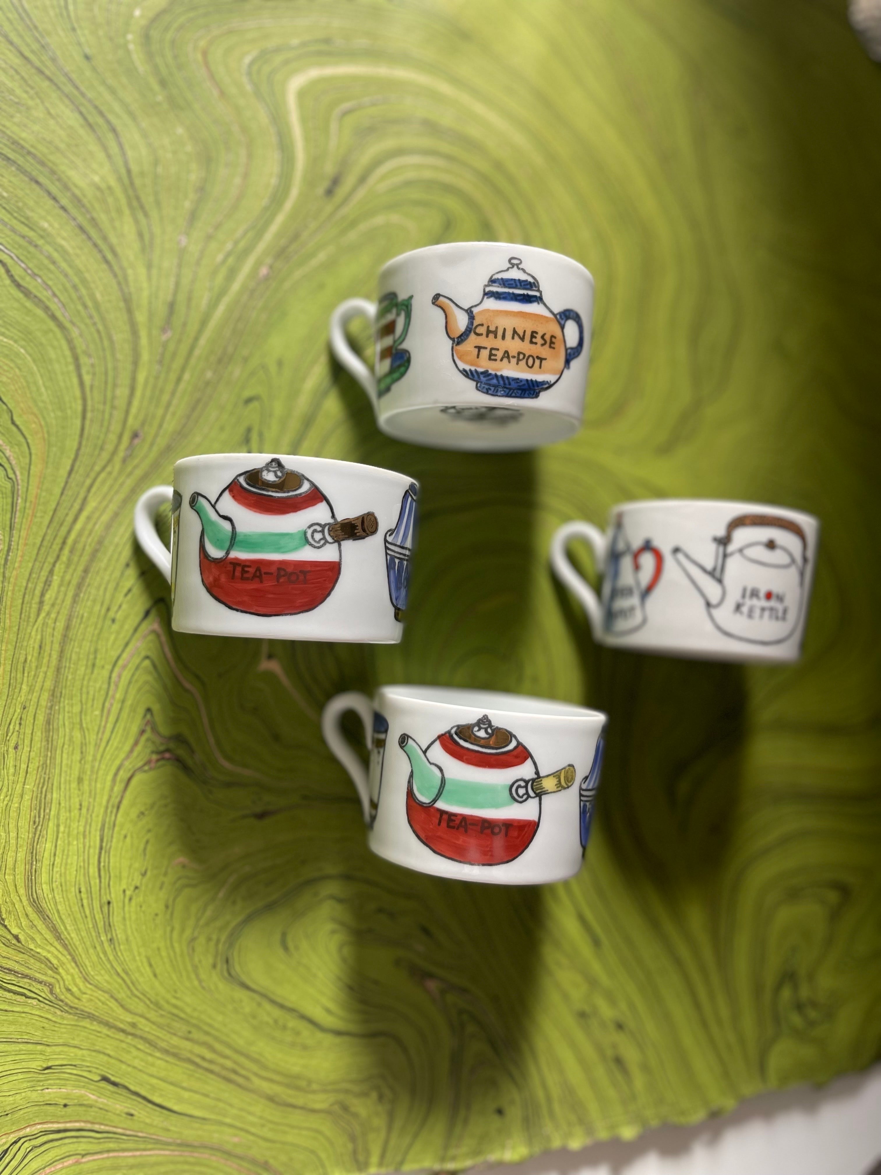 A not-often-seen vintage eight piece tea set from Piero Fornasetti with hand-painted lithographic transfer decoration. The theme here is the iconography and ritual of tea-drinking. On the cups are different kinds of tea containers, together with