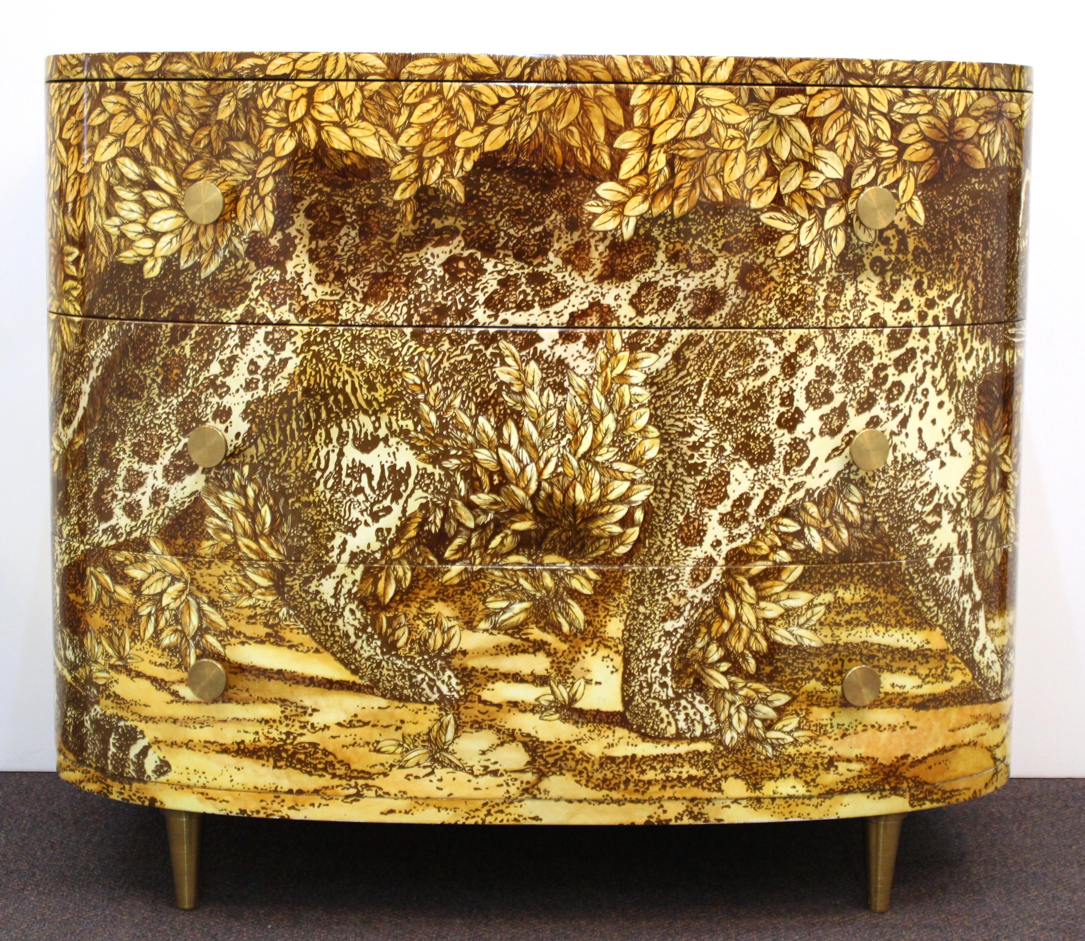 Italian modern Fornasetti 'Leopardo' curved chest of drawers or commode with lithographed, hand-colored and lacquered leopard design on wood and with brass hardware. Fornasetti makers label on the upper front edge of the upper drawer. Marked