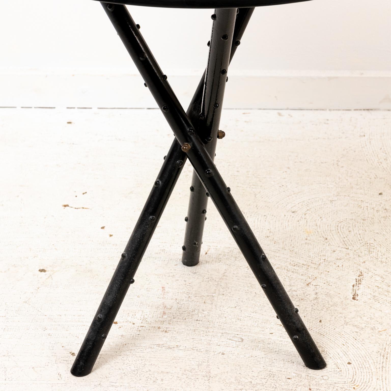 Circa 1960s Italian side table on a tripod base with illustrated tabletop depicting the twelve signs of the Zodiac and astrological figures. The piece also comes with a clear glass top. Please note of wear consistent with age.