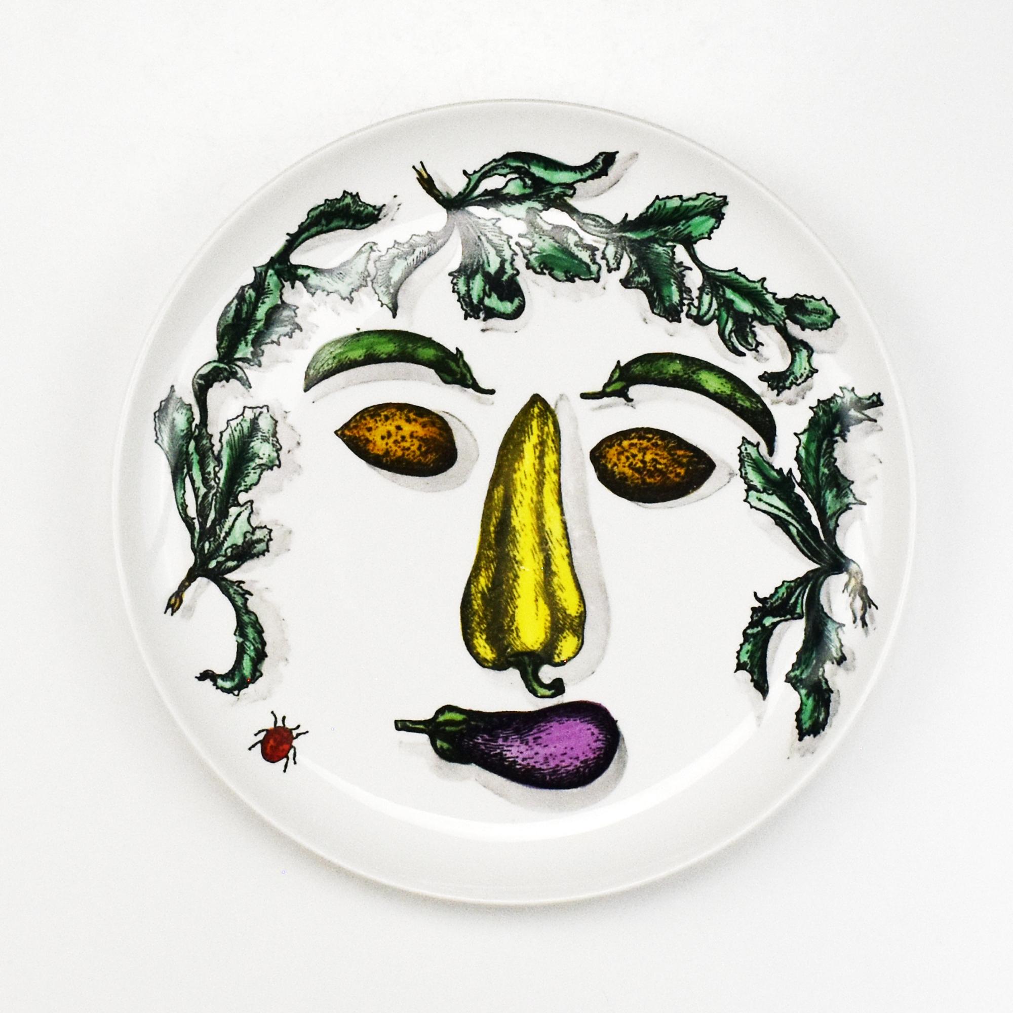 A vintage set of four plates by Piero Fornasetti from the 