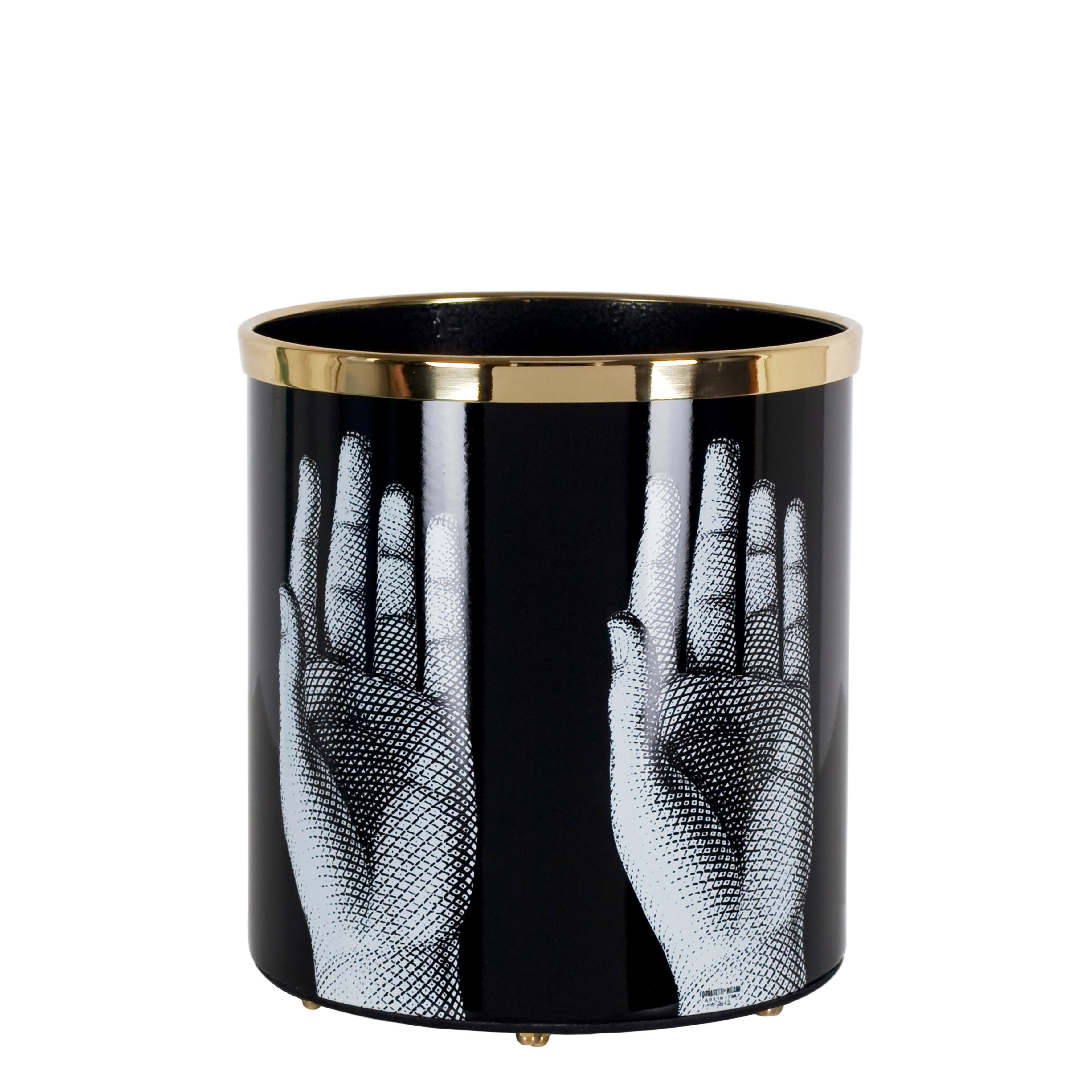 Like all Fornasetti accessories, the paper basket is handcrafted using original artisan techniques. This piece is silk-screened by hand, painted by hand and covered with a smooth lacquer.

The shape is still the same designed by Piero Fornasetti