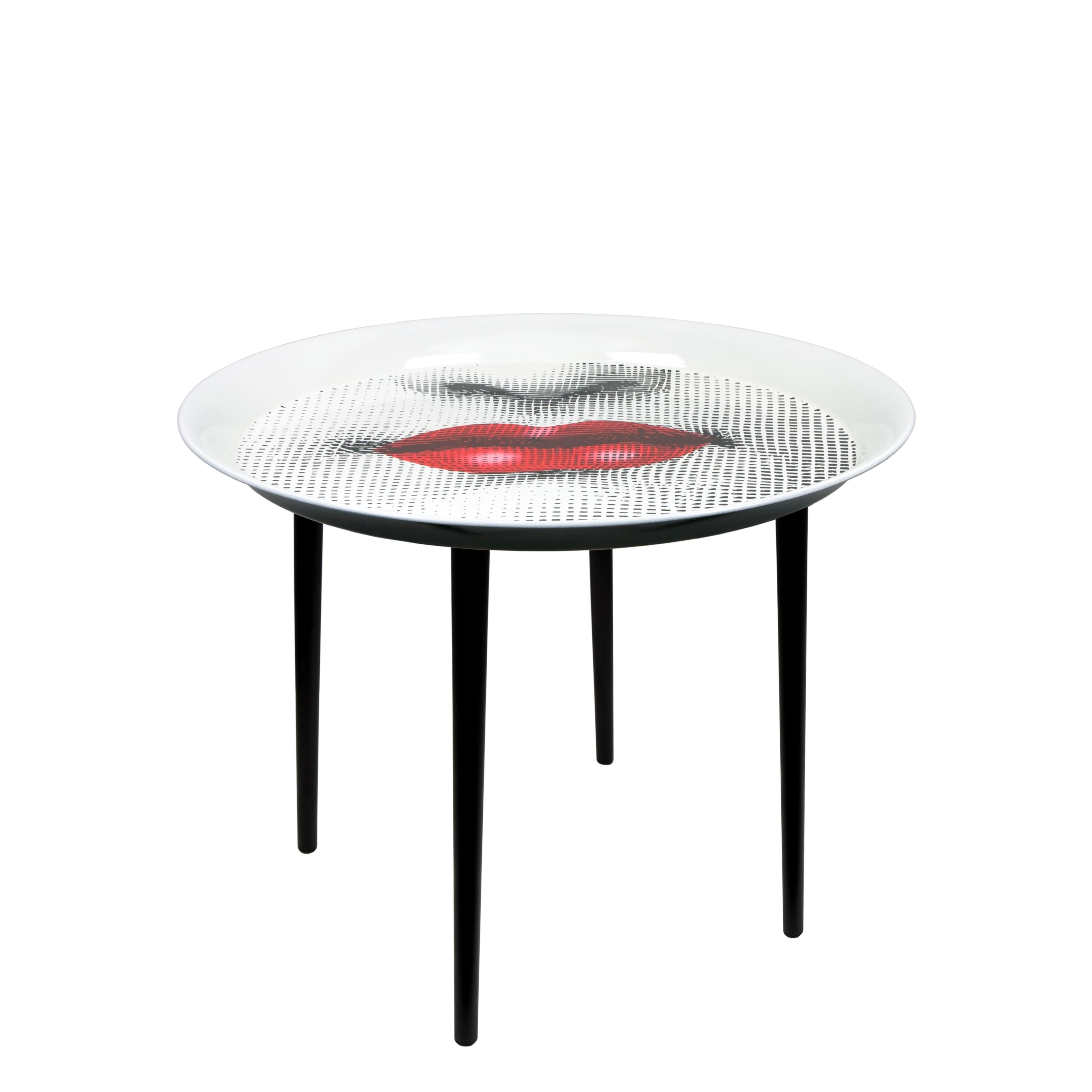 Like all Fornasetti accessories, the tray is handcrafted using original artisan techniques. 
This tray is silk-screened by hand, painted by hand and covered with a smooth lacquer.

  

The tray is the object with more variations than any other