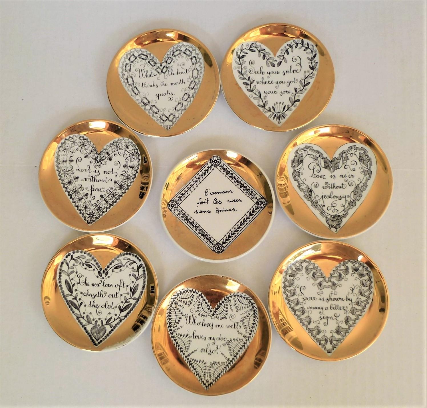 Perfect gift for the lover in all of us, 8 decorated love coasters, all by Piero Fornasetti and one by Bucciarelli, 1950s. Featuring English love themed messages in hearts the centers, they all have gilt backgrounds. The Buccirelli in a diamond in