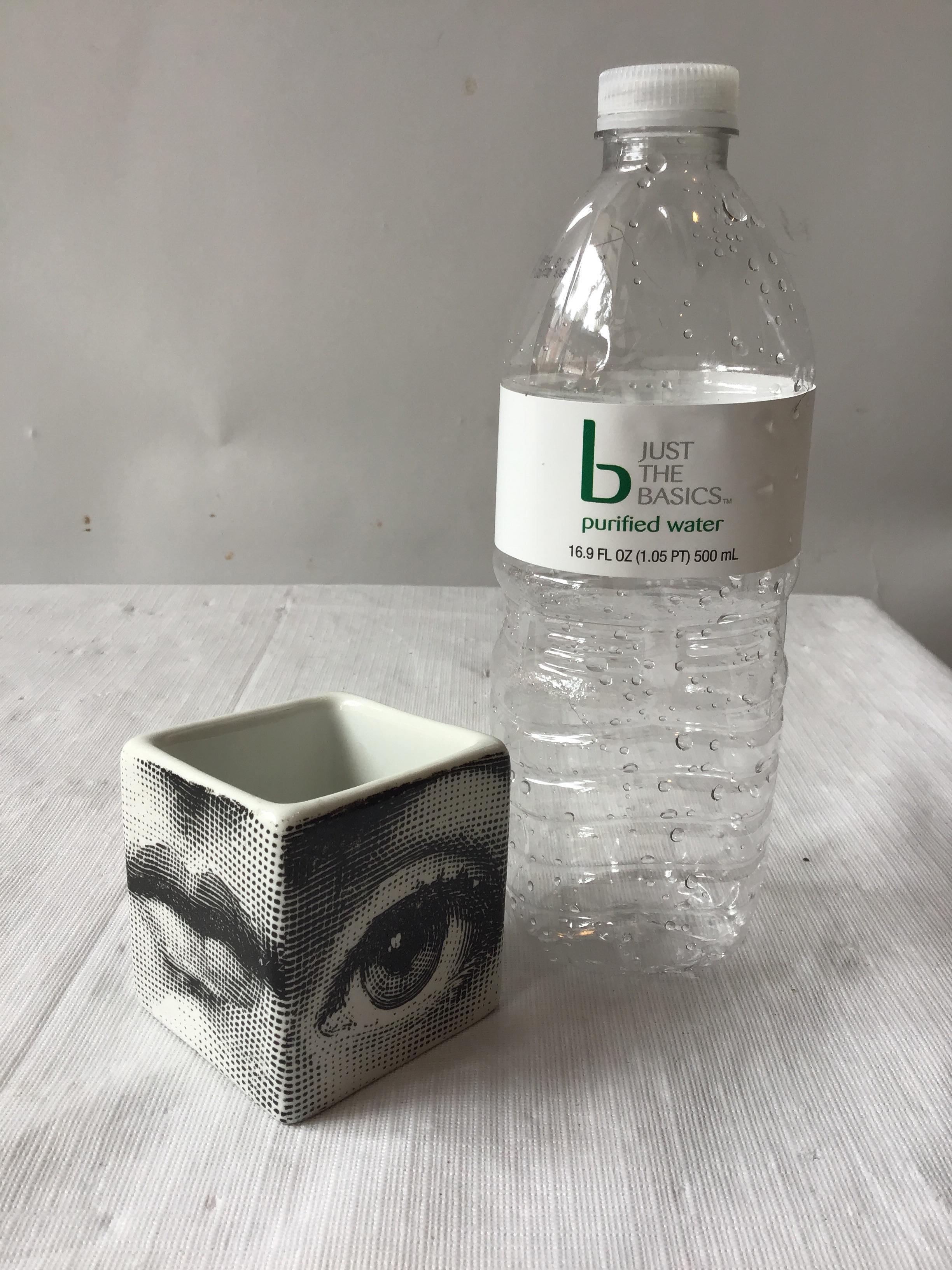 1960s Fornasetti small cube vase of a face.