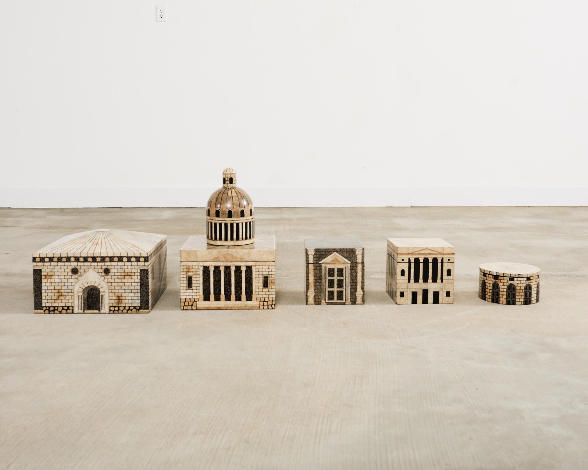 Fascinating and rare set of seven boxes featuring a lacquered eggshell veneer attributed to French artist Thierry Voeltzel. Each box is designed with Greco-Roman neoclassical architecture depicting stone buildings with columns. Each box has a top