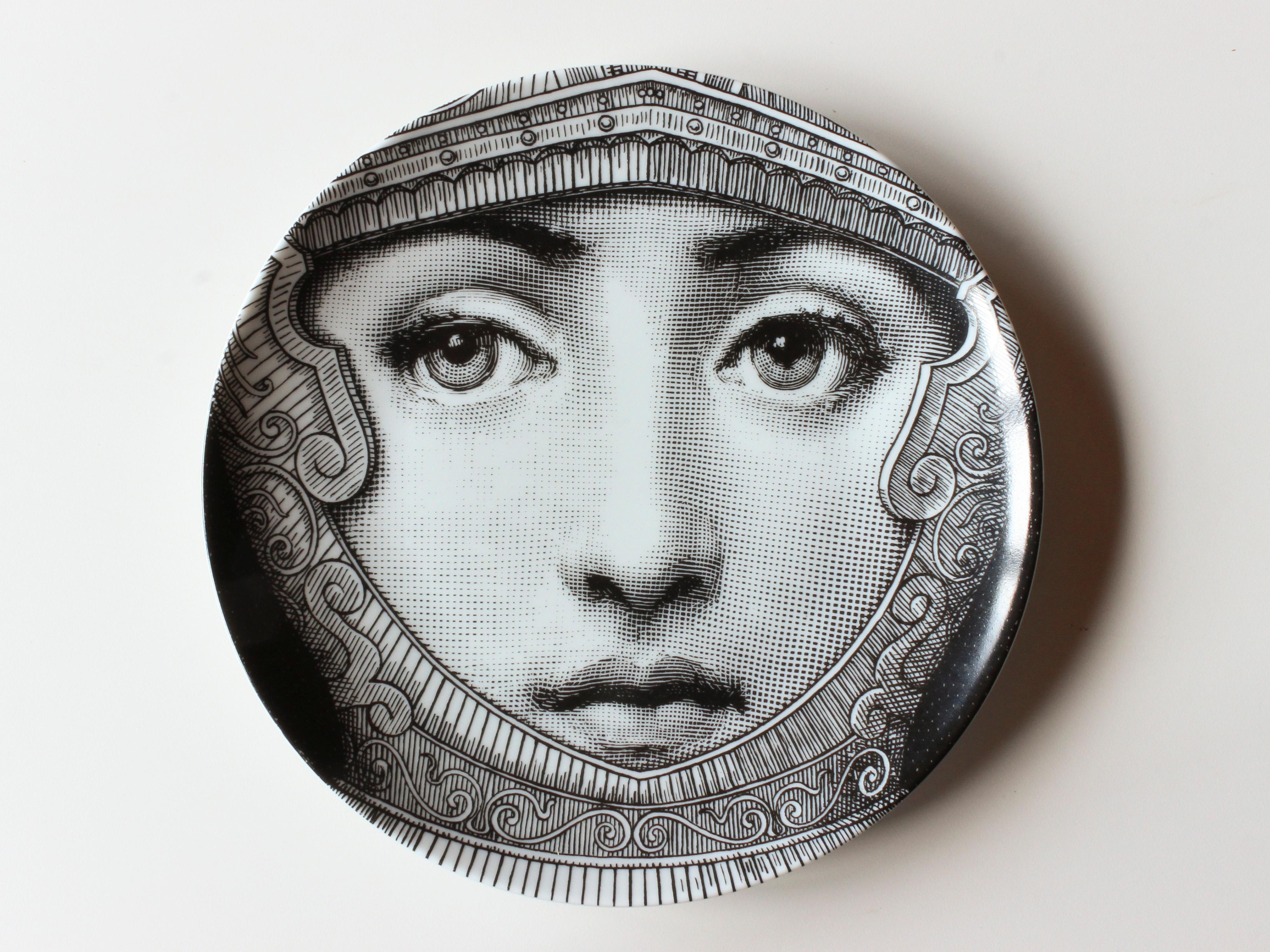 Two 1990s Fornasetti Tema e Variazioni black and white porcelain plates depicting Lina Cavalieri, the muse of Piero Fornasetti (1913-1988). Numbers 9 + 95. Very good vintage condition.