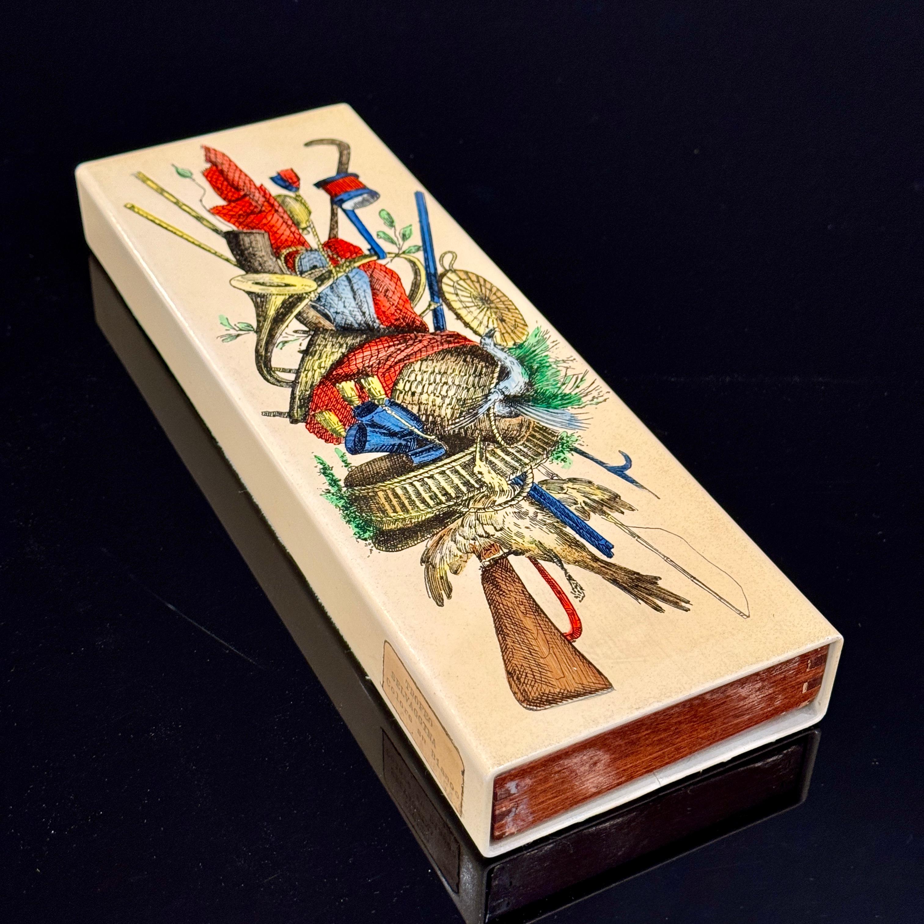 This small painted wooden box is an iconic piece by the renowned Italian artist and designer Piero Fornasetti. Created in the 1950s, it reflects Fornasetti's unique style, blending traditional craftsmanship with elements of surrealism and humor. 