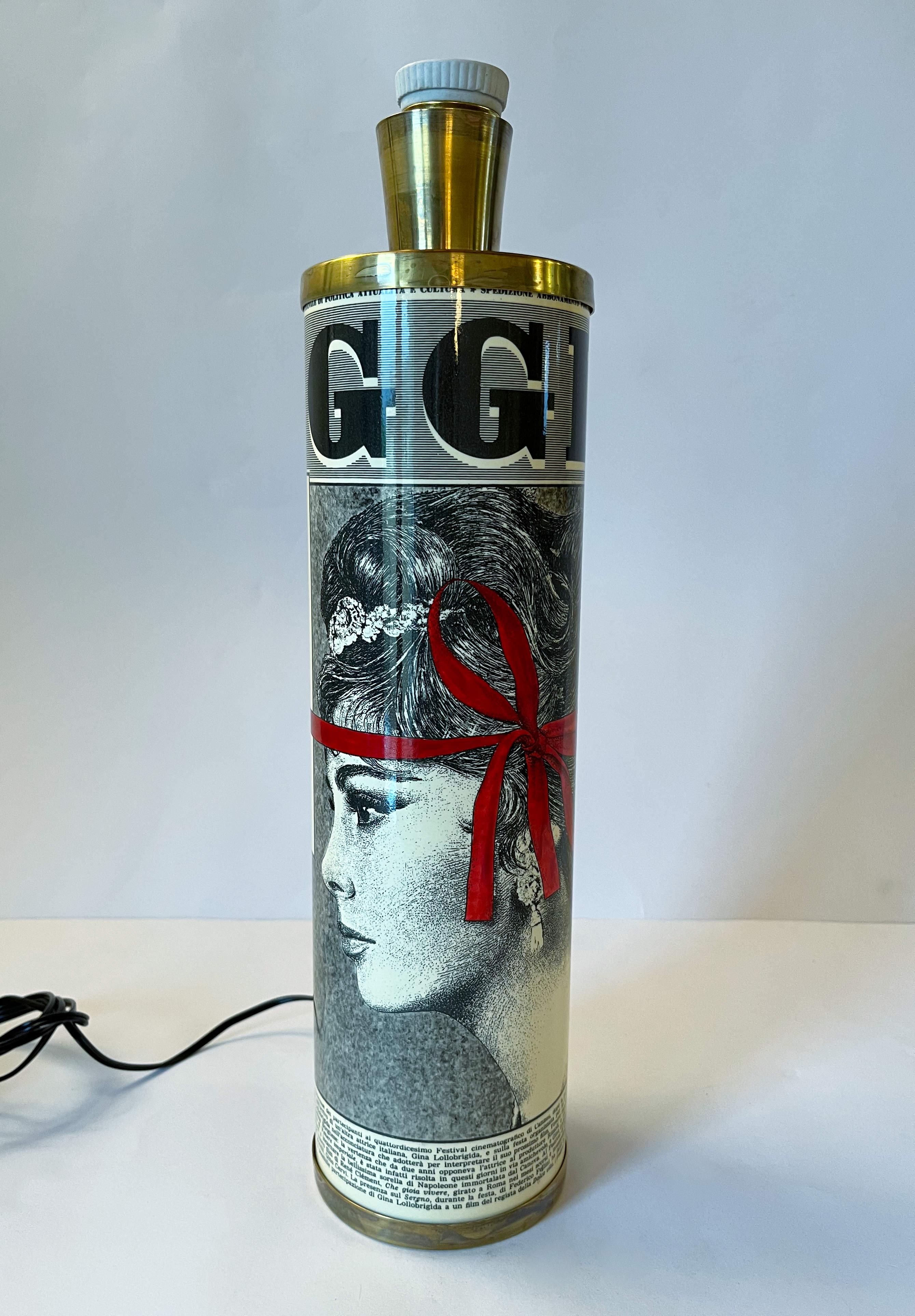 Vintage Italian Oggi Maria Pia newspaper table lamp with painted metal (lithographical and transfer-printed) and brass / made in Milan Italy in the 1980s
Original label on the base
1 light / E26 or E27 type / max 60W 
Measures: diameter 4 inches,