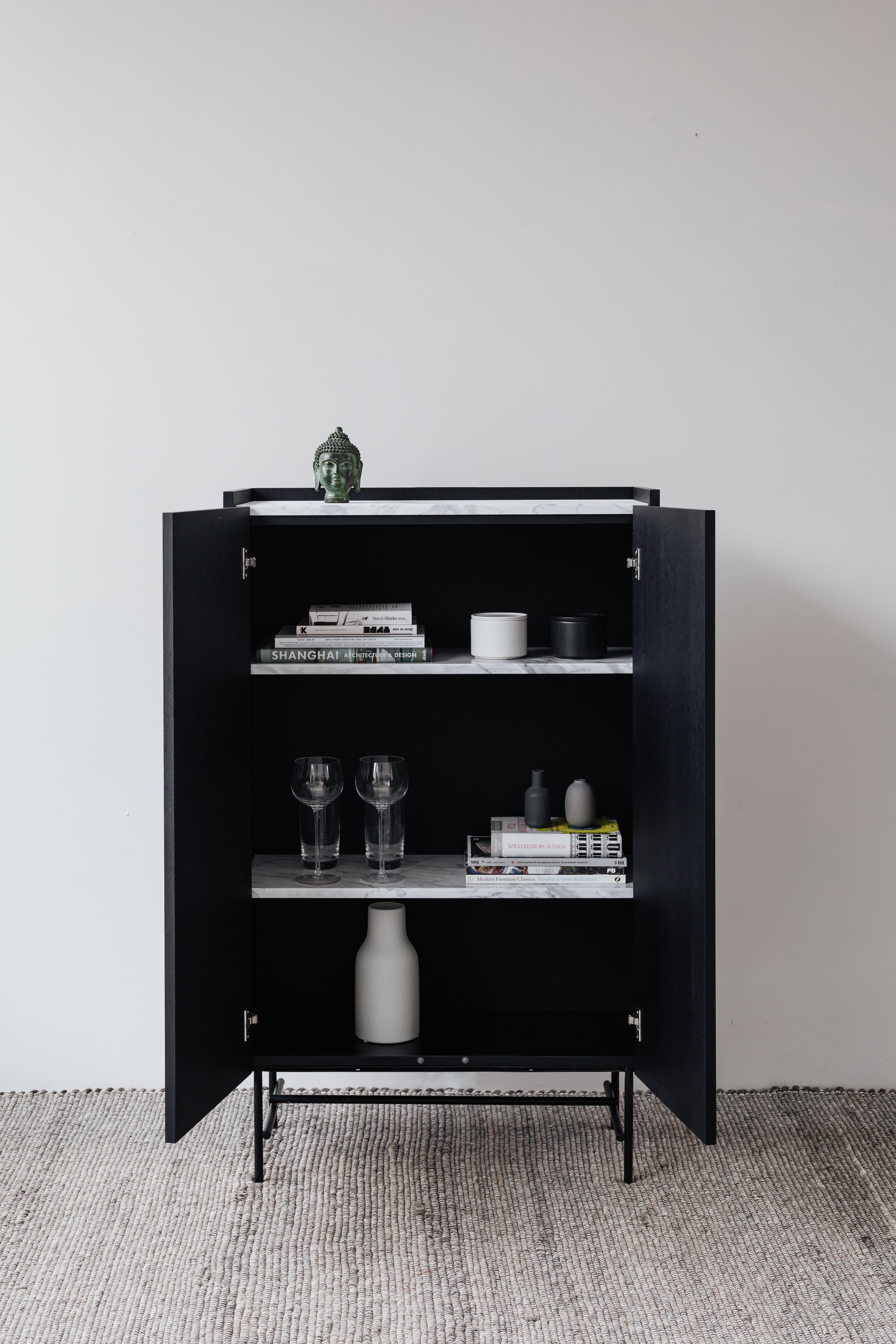 FORST Cabinet is the queen of storage. It is the perfect choice for your living room and bedroom, concealing two marble shelves to store items that deserve a special setting. The dresser has a TIP-ON opening system. The beautiful top is available in