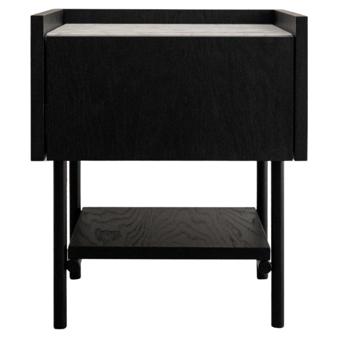 FORST nightstand is an elegant bedside table with a marble top and a comfortable drawer opened with the TIP ON system. The open shelf will allow you to conveniently store things that should always be at hand. The top of the table is finished with