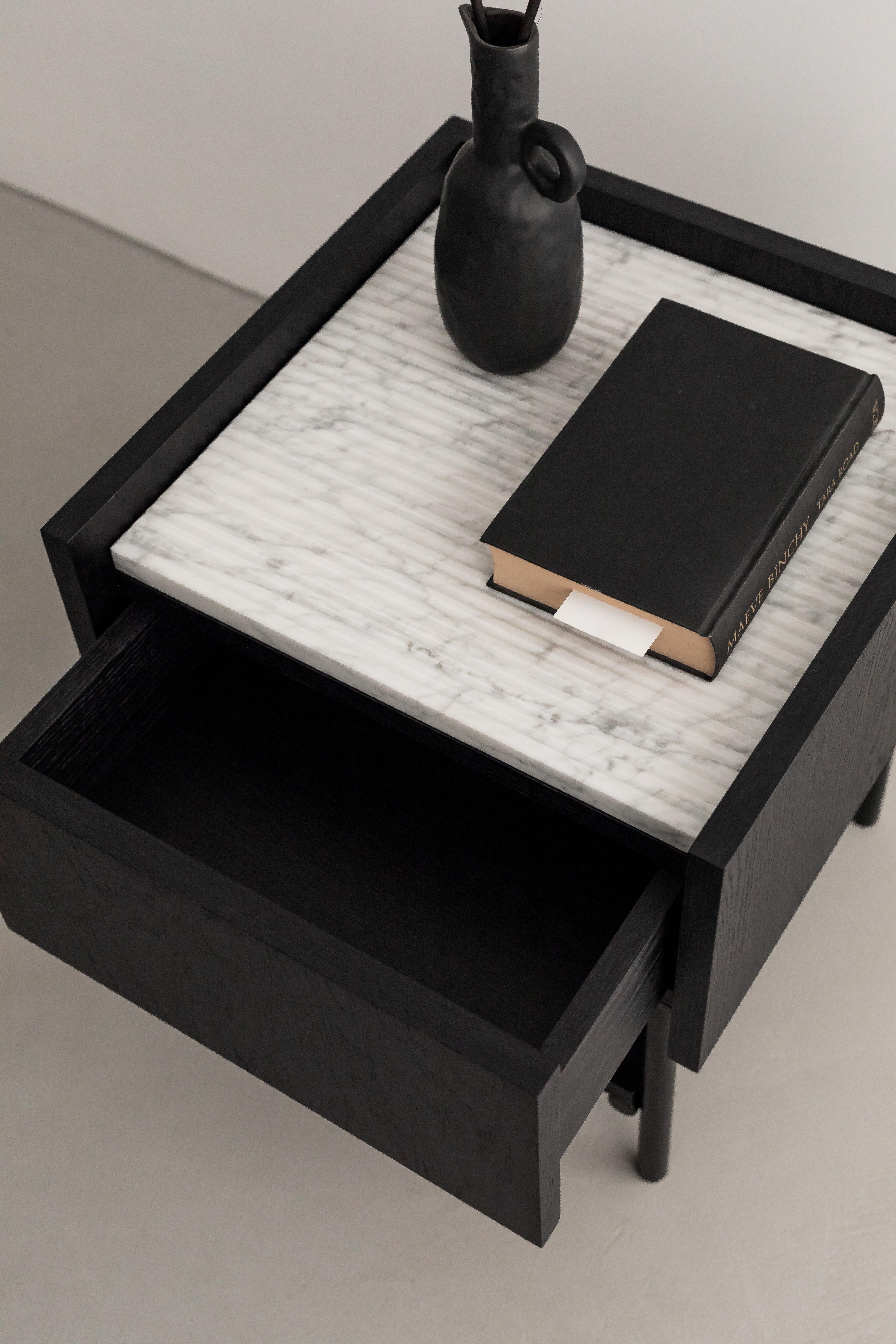 FORST NIGHT STAND is an elegant bedside table with a marble top and a comfortable drawer opened with the TIP ON system. The open shelf will allow you to conveniently store things that should always be at hand. The top of the table is finished with