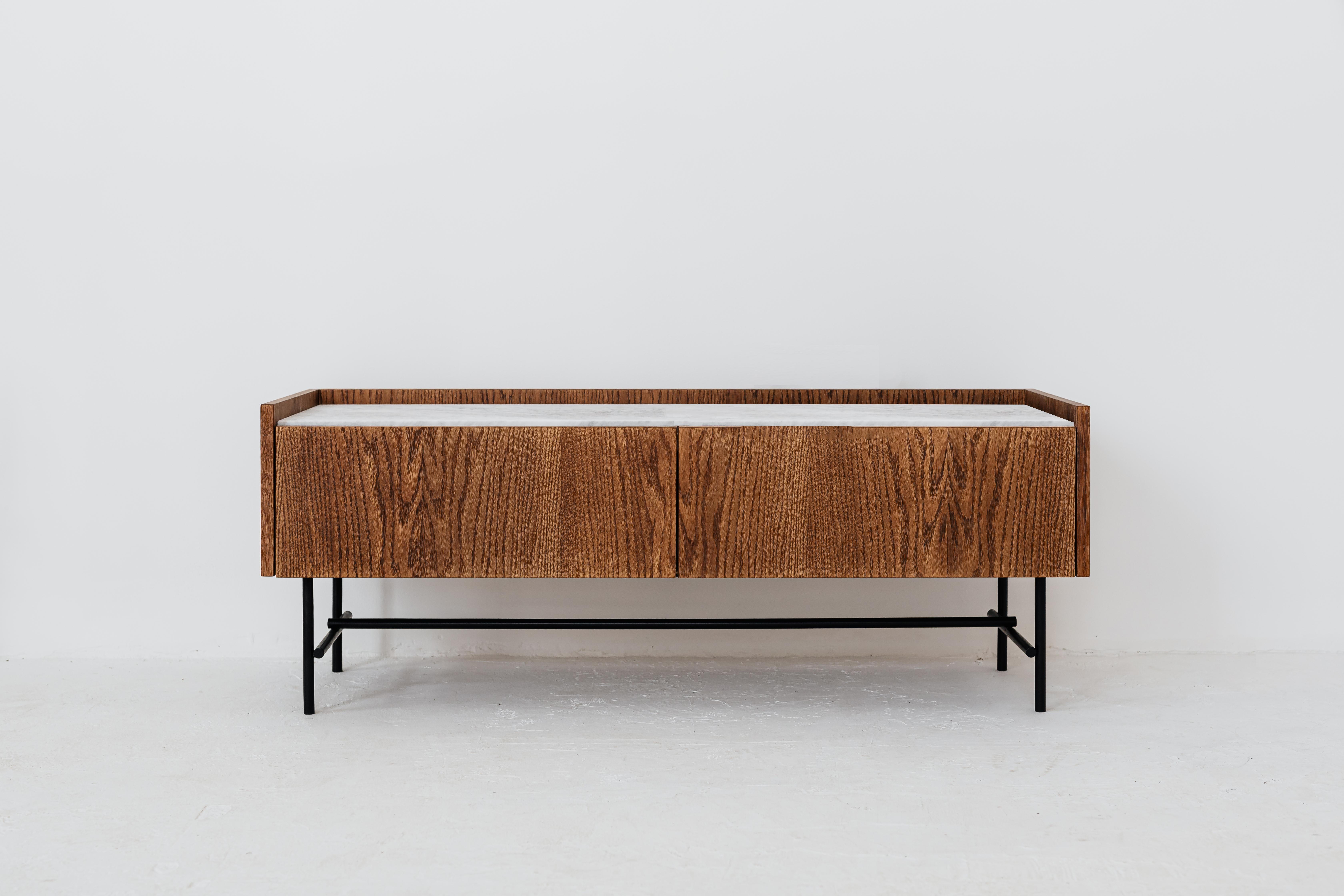 Forst Sideboard 2.0 by Un’common
Designed by Małgorzata Korycka.
Dimensions: D 40 x W 120 x H 46 cm.
Materials: Oak and brushed Carrara marble.

Available in different oak finishes. Available in different marble options. Please contact us.

FORST