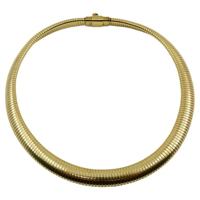 A vintage 14k gold tubogas necklace by Forstner.  The Tubogas style draws its inspiration from gas pipes design. Carlo Weingrill adapted it to jewelry making  in the 1940s.  As the name suggests, Tubogas is flexible and can be applied to various