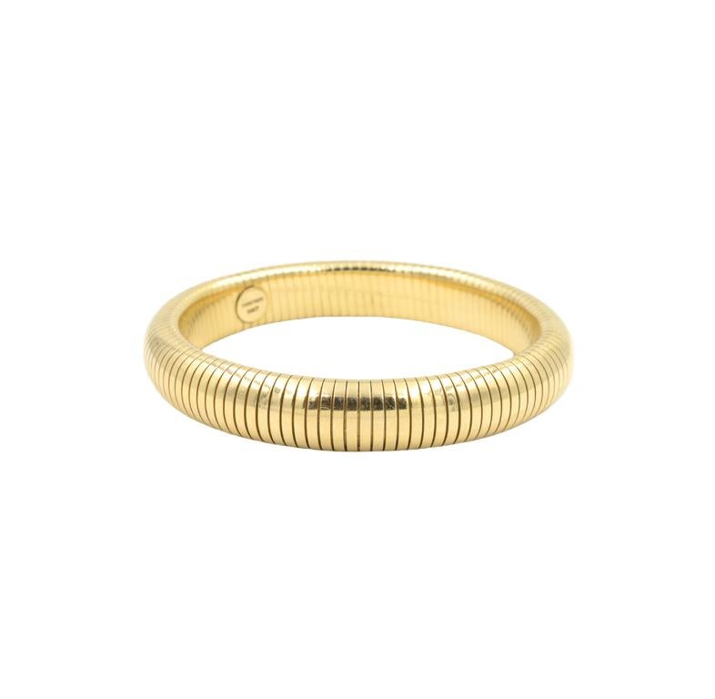 Rare Forstner Tubogas bracelet, 7 inches around the inside.  In 14k yellow gold, 11mm wide.  Signed 