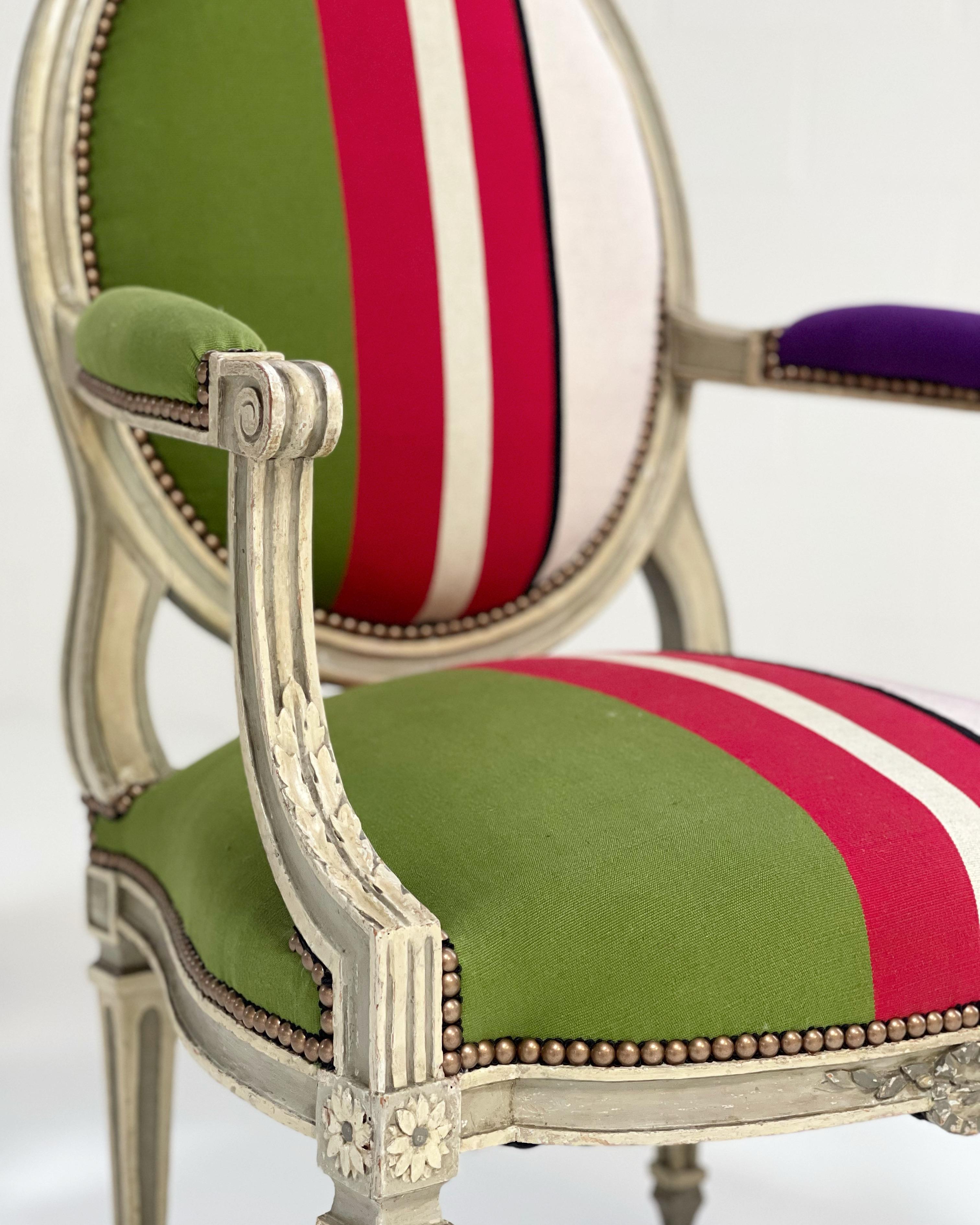 This beautiful pair is a show-stopper. During restoration, the chairs were completely rebuilt. For the finish, we chose the gorgeous Cristobal Throws by fashion brand, Colville. The vibrant colors and pattern create a modern piece destined for an