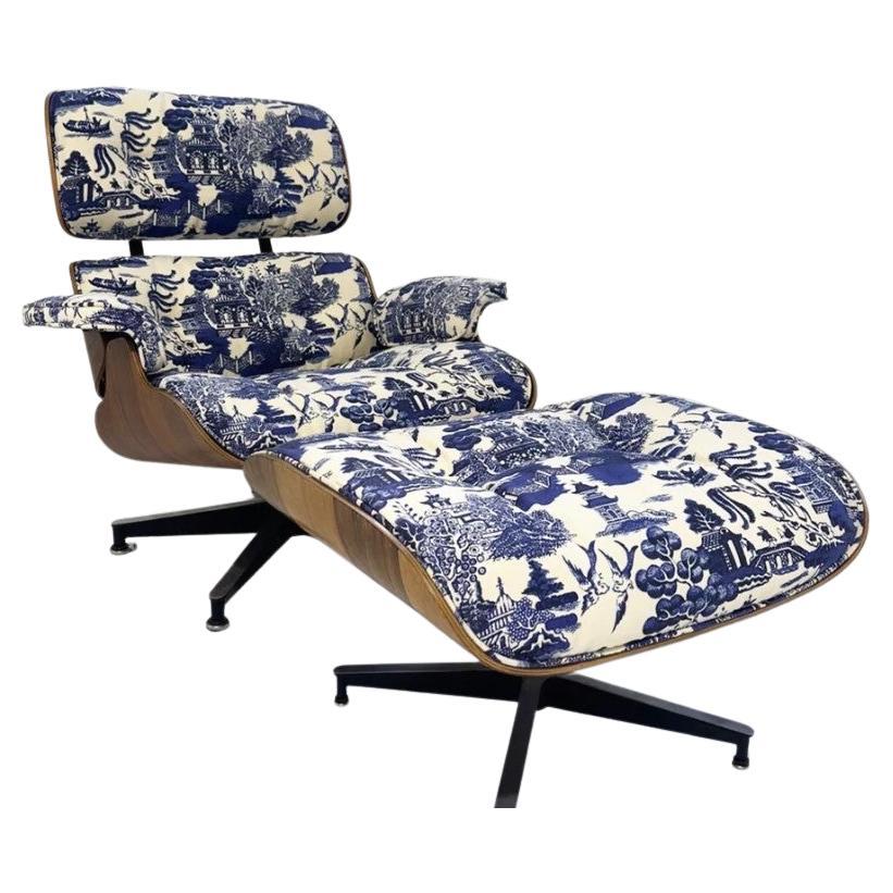 This classic Eames Lounge and Ottoman expertly restored in Beata Heuman's 'Willow' fabric. We love the juxtaposition of this mid-century icon and the more traditional toile. The set is from the early 1970s in rosewood. Labels on underside.

