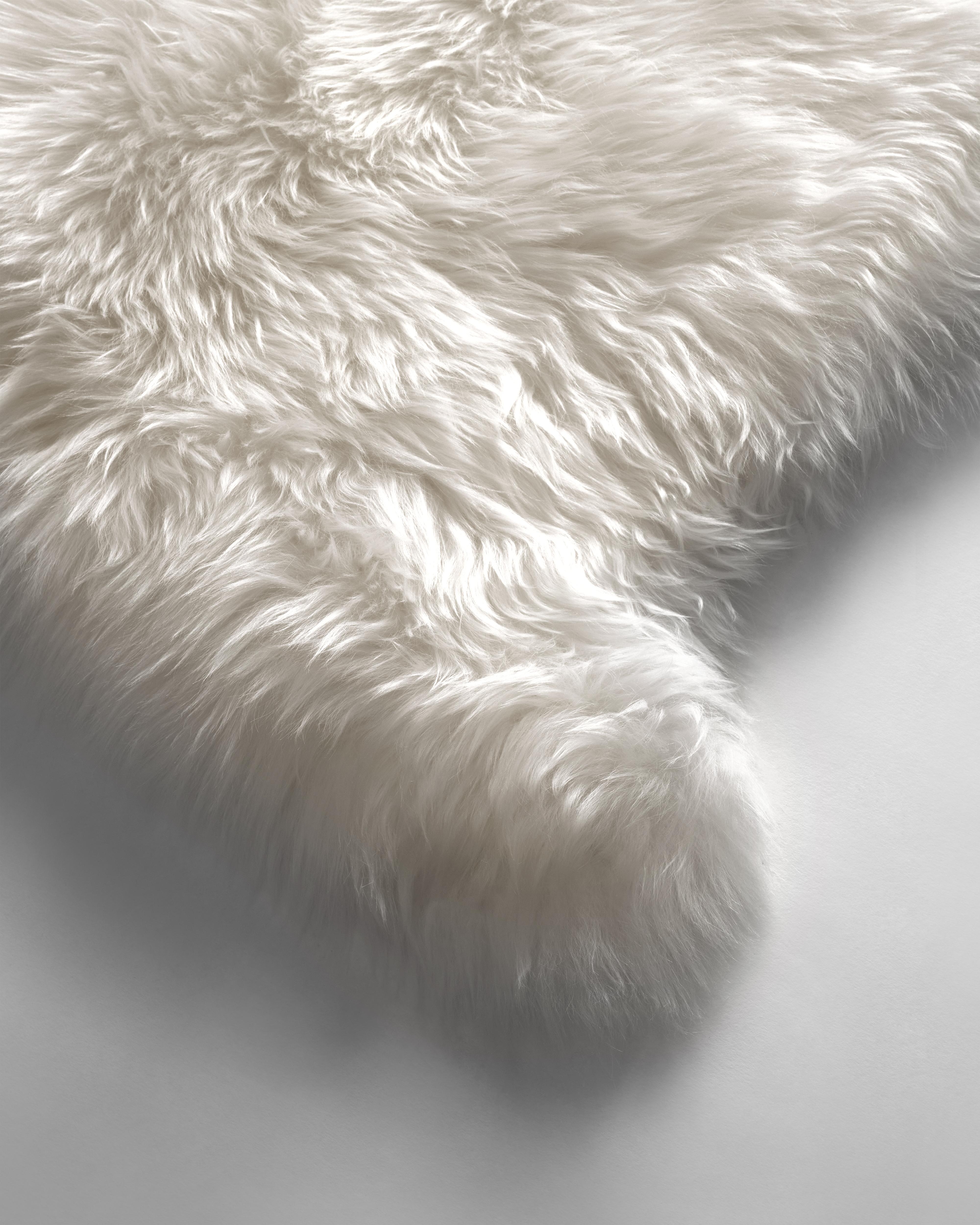 The naturalness and softness of a sheepskin rug can quickly elevate a room's beauty. On the floor, thrown over chairs and couches, this versatile design piece is a favorite of the Forsyth design team. 

This thick and beautiful sheepskin in natural