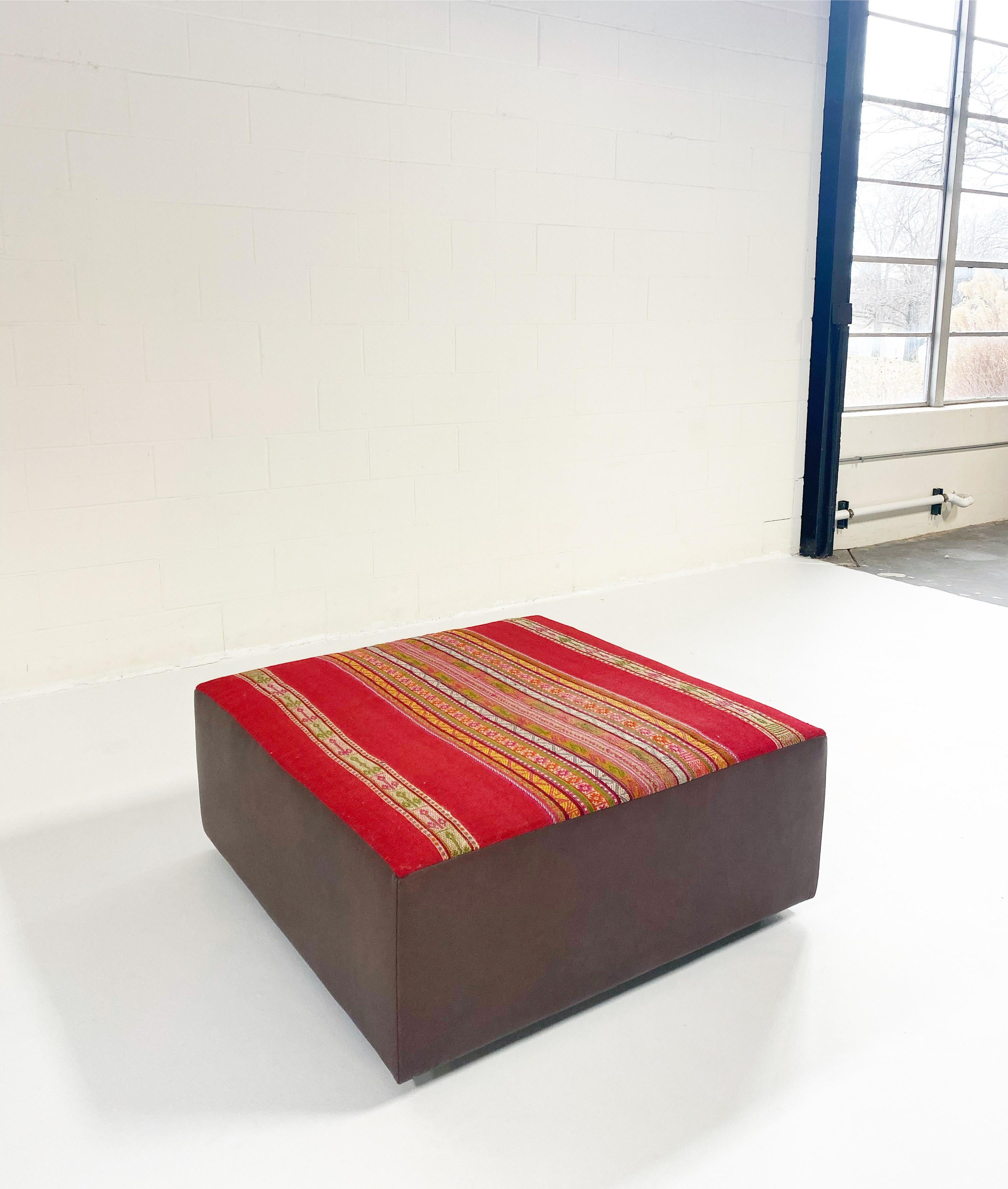 A one-of-a-kind ottoman designed by Forsyth and beautifully handmade using a vintage textile from Peru. The textile is finished with luxurious leather sides. The perfect coffee table, ottoman, or extra seating. We love the bohemian aesthetic and