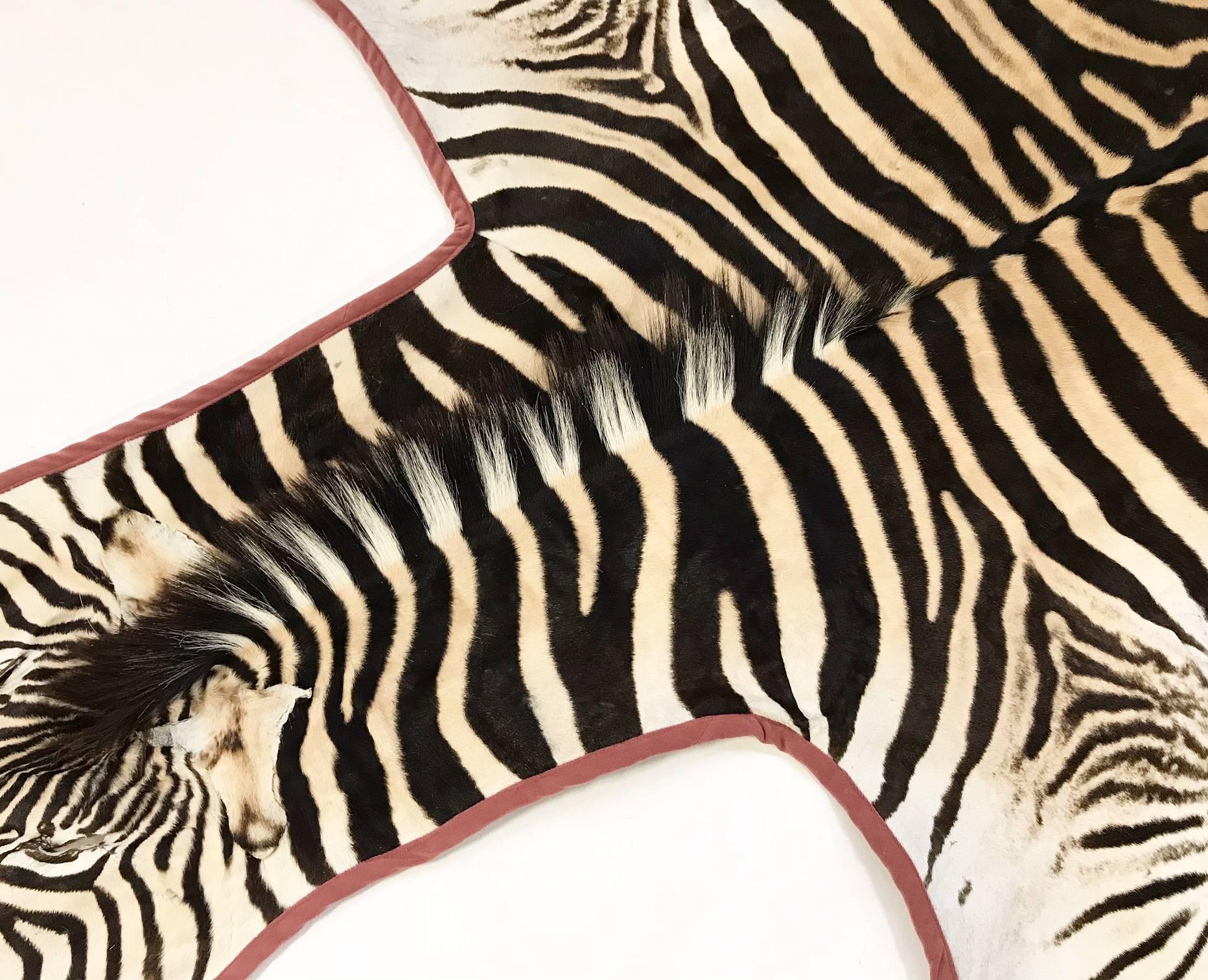 Forsyth master upholsterers trimmed this hand-selected zebra hide with our luxurious velvet and finished it with our khaki cotton canvas backing. We love the elegance the leather brings to the rug. 

Forsyth zebra hides are hand selected with a