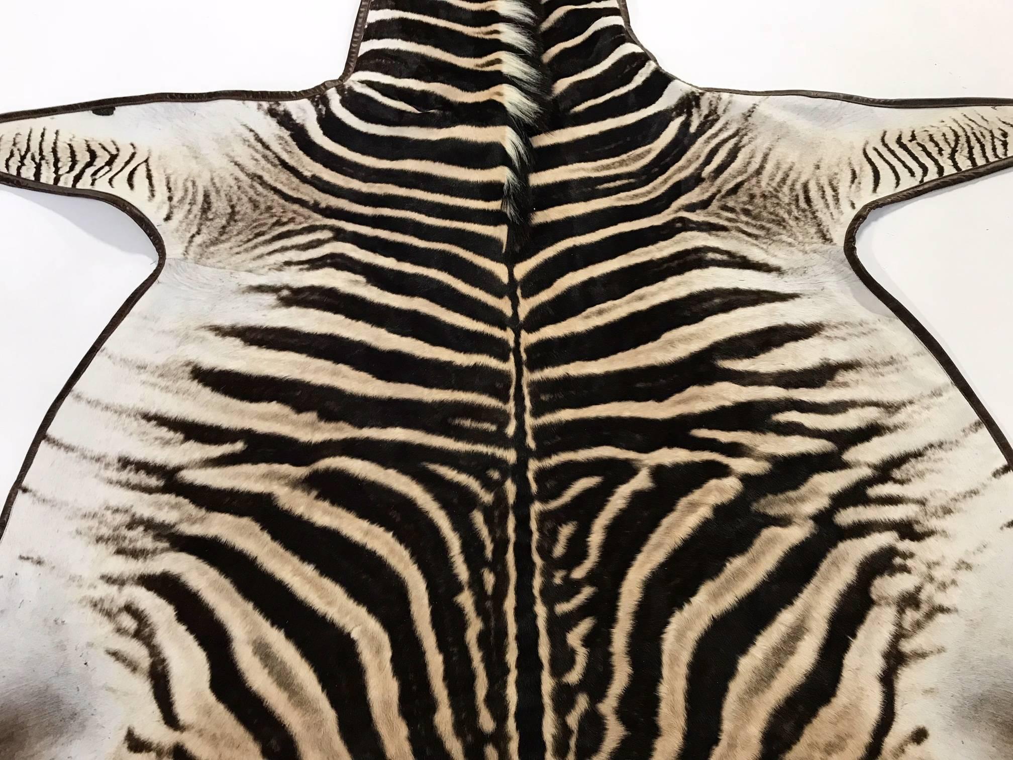 Forsyth Zebra Hide Rug Trimmed in Leather In Excellent Condition In SAINT LOUIS, MO
