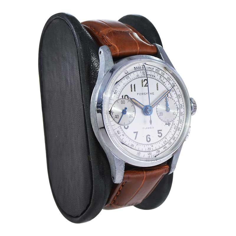 FACTORY / HOUSE: Forsythe Watch Company
STYLE / REFERENCE: Chronograph
METAL / MATERIAL: Steel 
CIRCA / YEAR: 1940's / 50's
DIMENSIONS / SIZE: Length 43mm x Diameter 34mm
MOVEMENT / CALIBER: Manual Winding / 17 Jewels 
DIAL / HANDS: Original