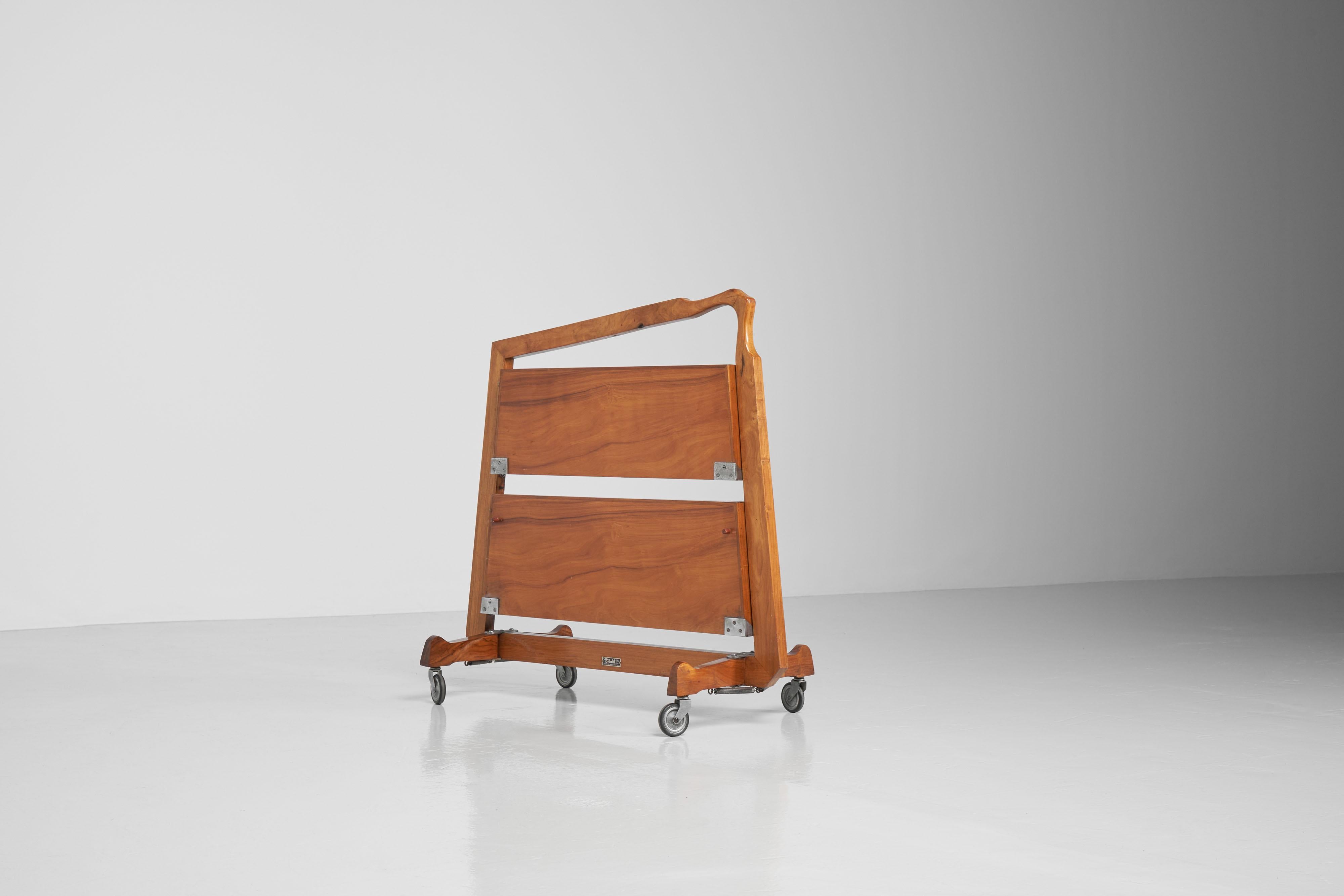 Sculptural shaped and foldable serving trolley designed and manufactured by Fortalit Ltda, Sao Paulo Brazil 1960. This stunning serving cart has an unusual but very sculptural shape, a symmetrical. The clear lines in the design make this piece very