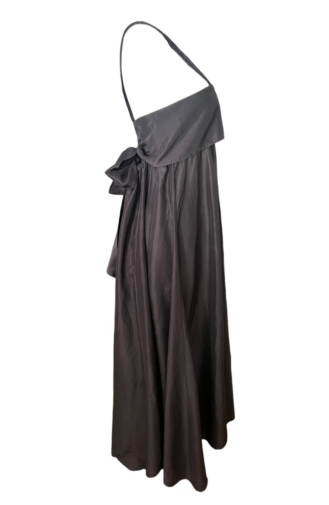 - Sleeveless with shoulder straps
- Open back 
- Rear bow tie detail
- Floor length
- Light fabric
- Loose fit
- Made in Italy  