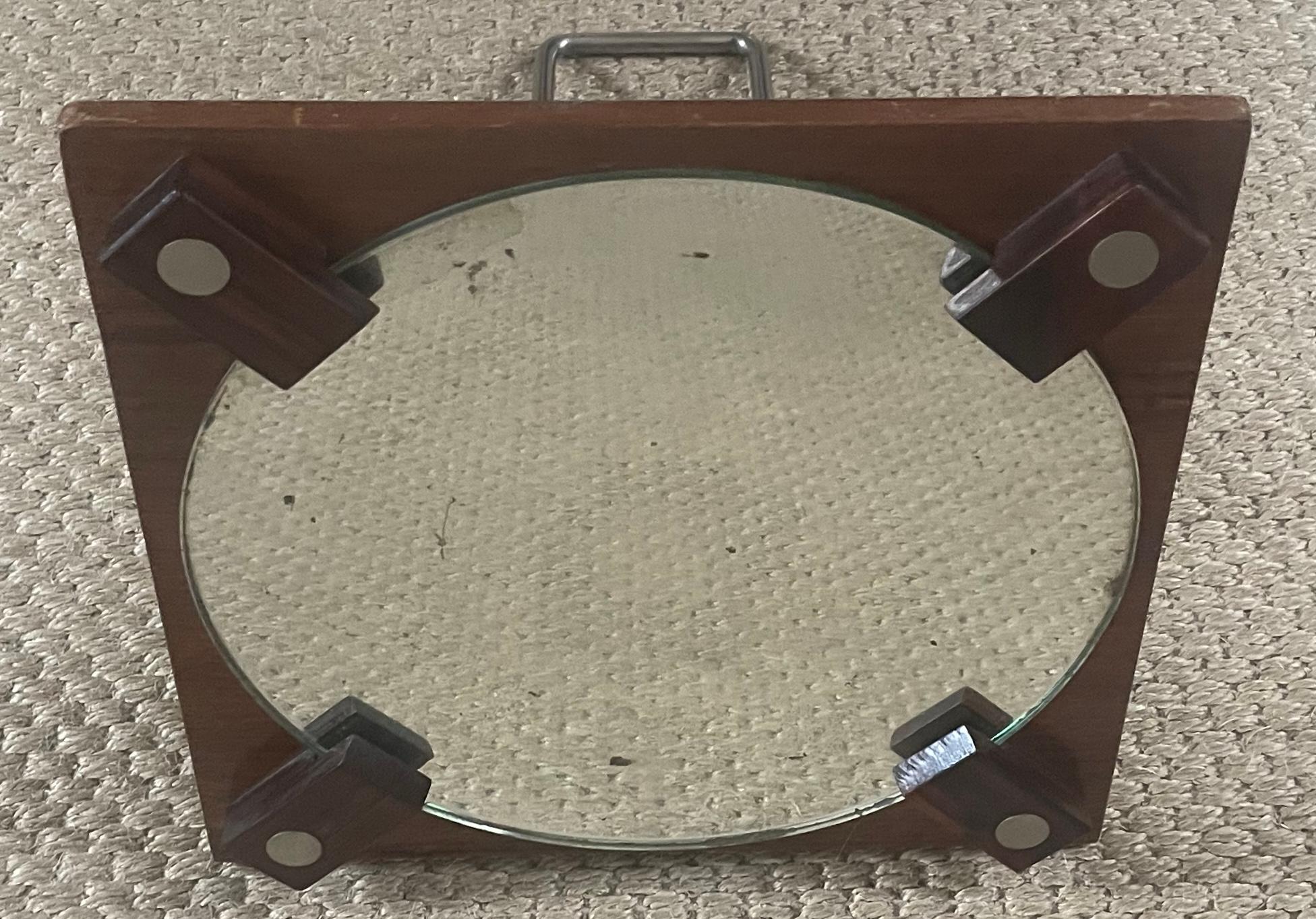 Vintage Rosewood and steel mirror. Forties square rosewood frame with original circular mercury mirror plate held by four rosewood clips in an Italian futurist style with adjustable steel stand arm for varied mirror angles or for hanging. Italy,