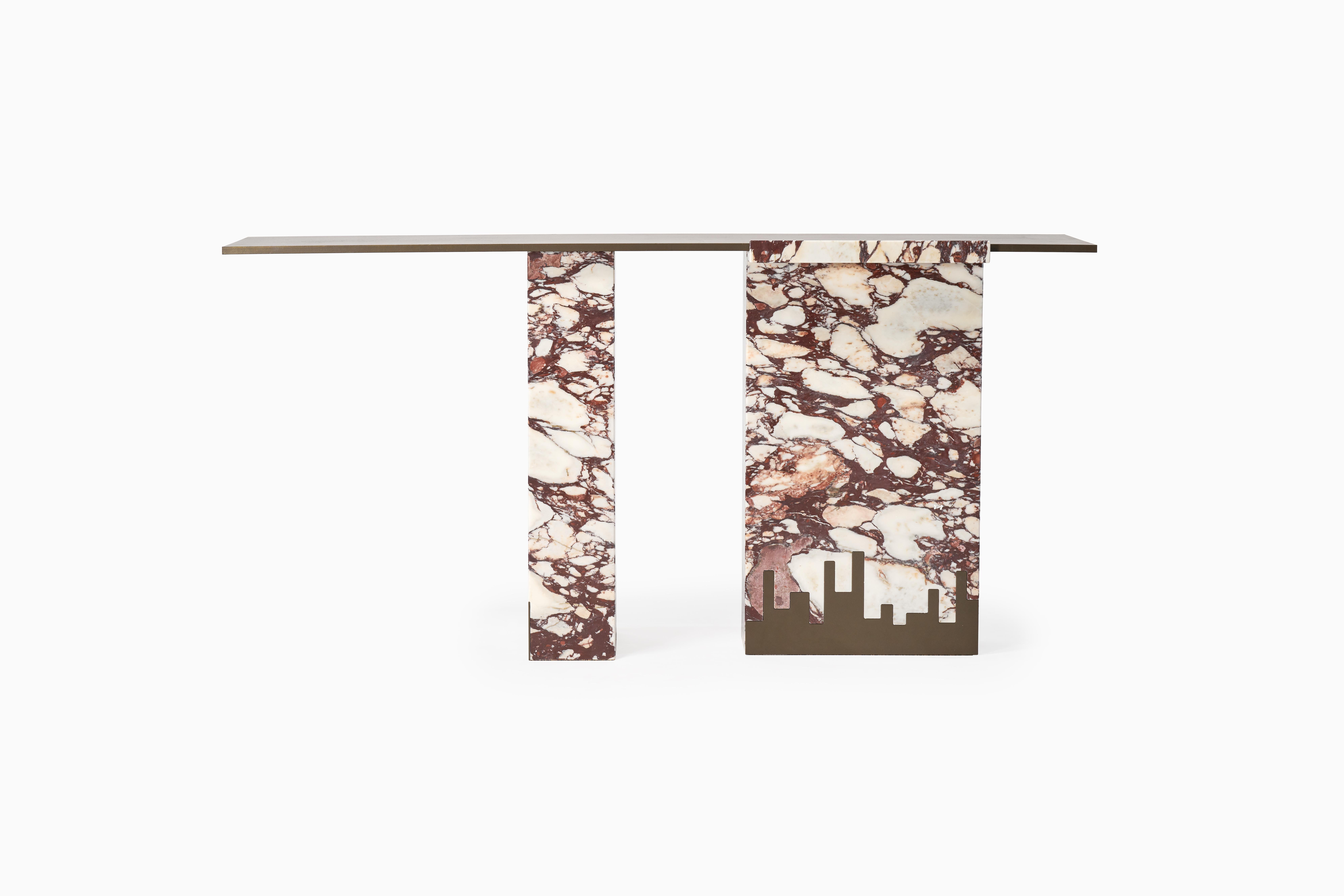 Fortis, derived from the Latin meaning of strong is reflected in this impressive piece. This console creates a protective warmth into the interior through colours drawn through the Calcutta Viola marble with a simple metal detailing trim to the