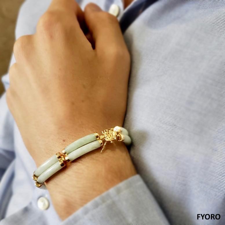 Fortune A-Jadeite Bracelet Double Bars with 14K Solid Yellow Gold links and clasp

Our 'Double Fu Fuku Fortune A-Jade Bracelet' embodies radiance and stature, with hand carved jade lengths intertwined with 14K Gold; a unisex statement. The two