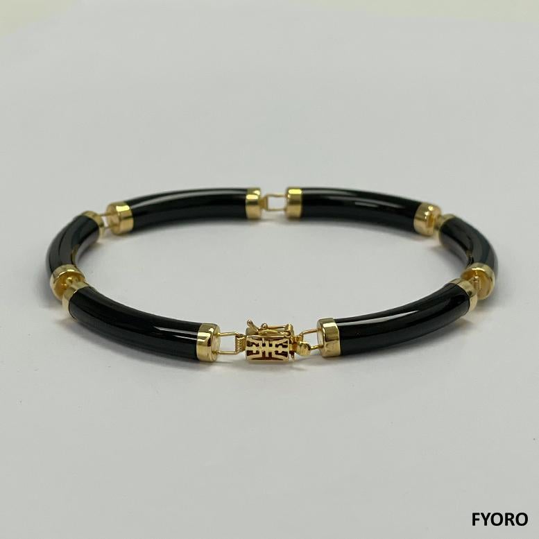 Fortune Onyx Tube Bars Armband mit 14K massivem Gelbgold Glieder und Schließe

Das Fu Fuku Fortune Black Onyx