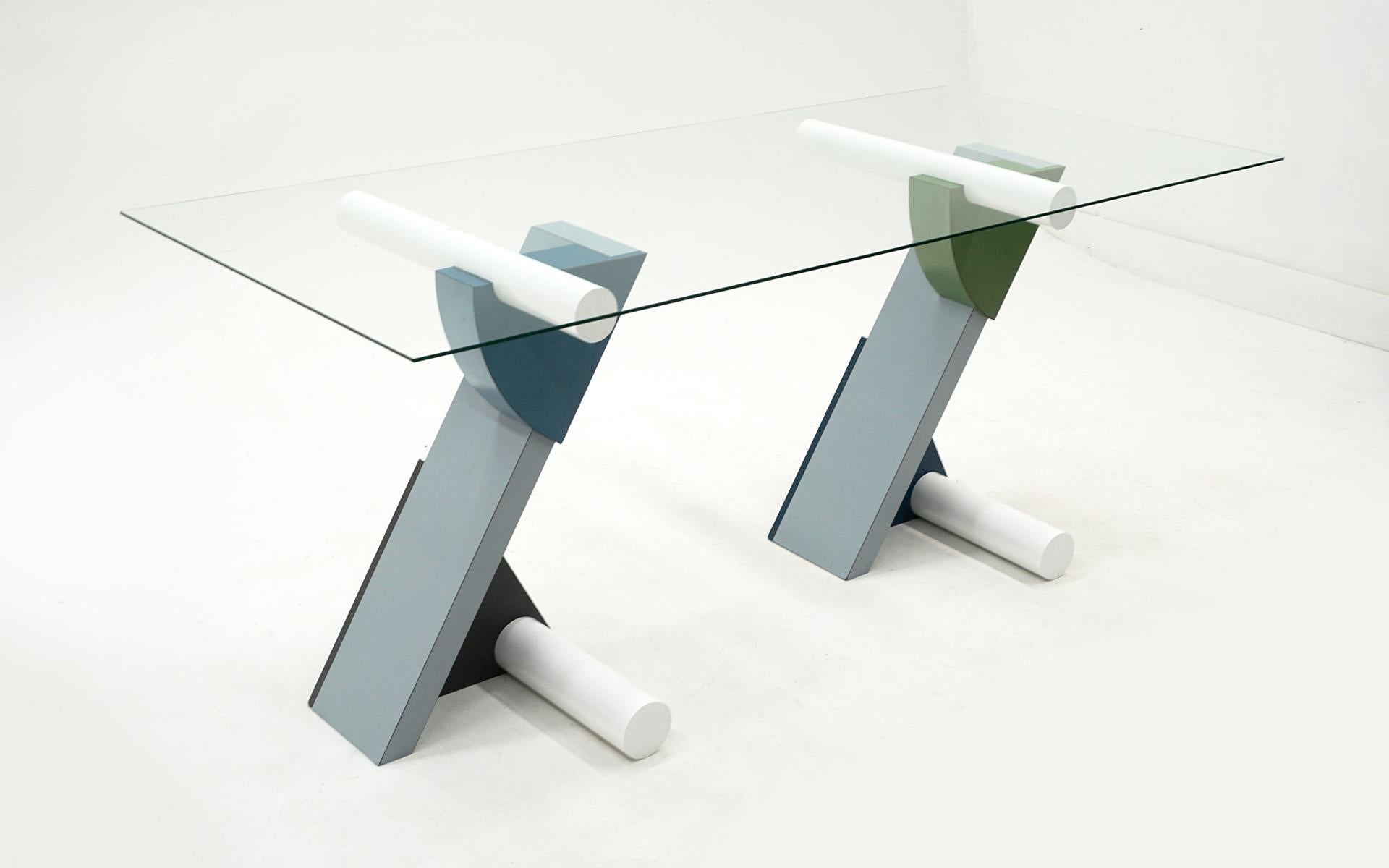 The fortune glass top table / desk designed by Michele de Lucchi for Memphis, Milano, Italy, 1982. Constructed of blue, green and gray laminate, lacquered wood and glass. This a rare early original example.